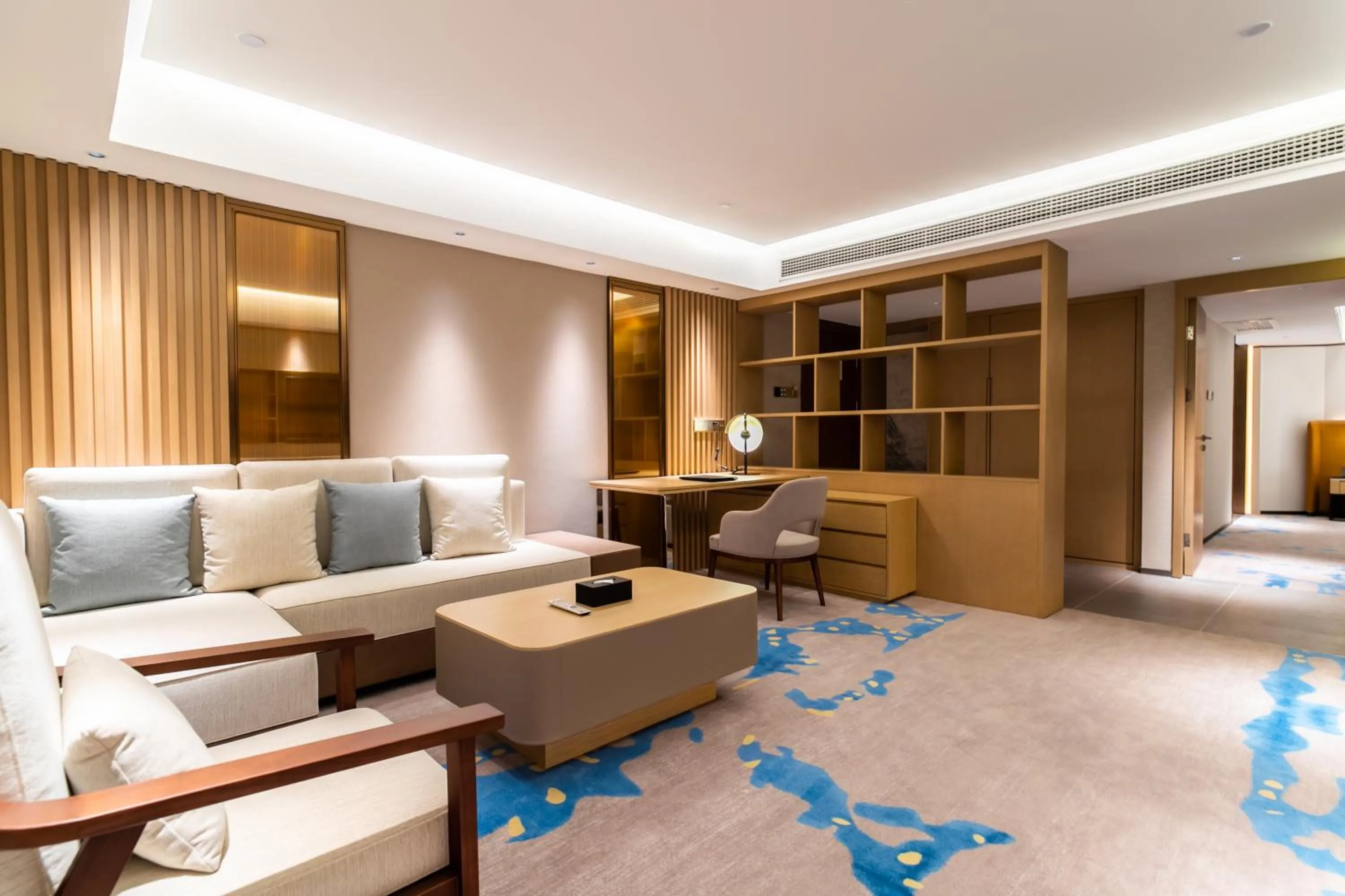 Living room, Bed in Landmark International Hotel