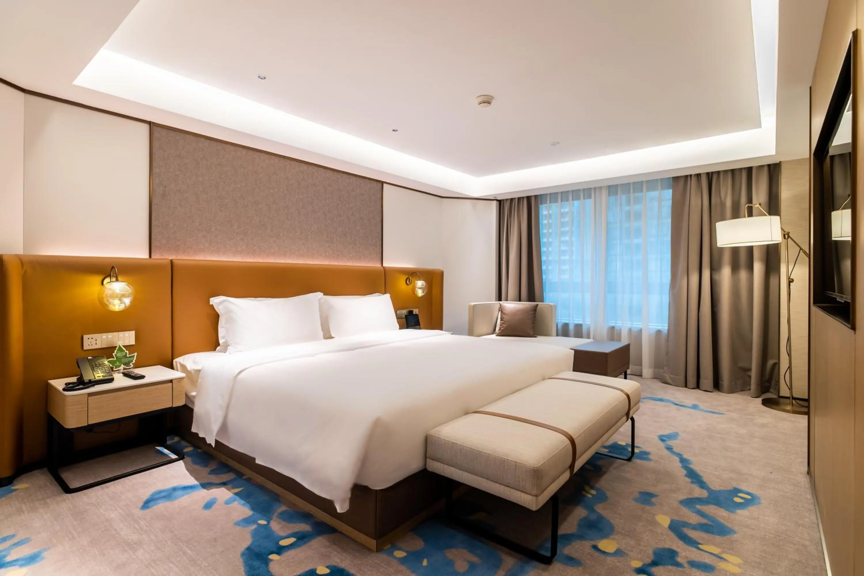Bed in Landmark International Hotel