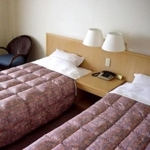 Bed in Kaike Grand Hotel Tensui