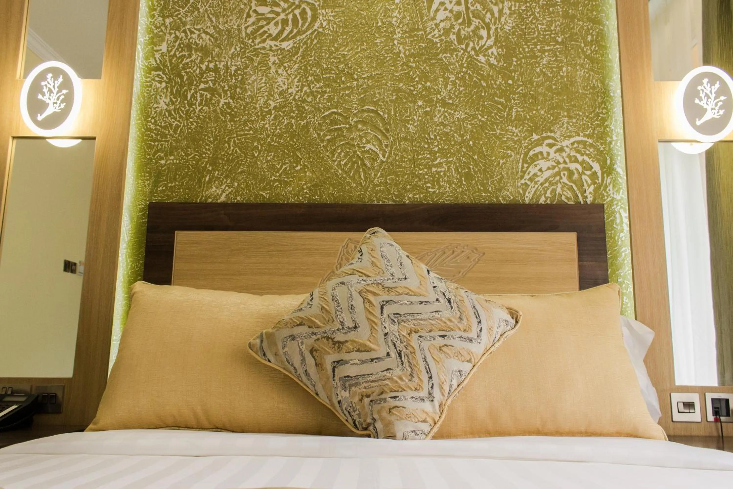 Bed in Elysian Resort