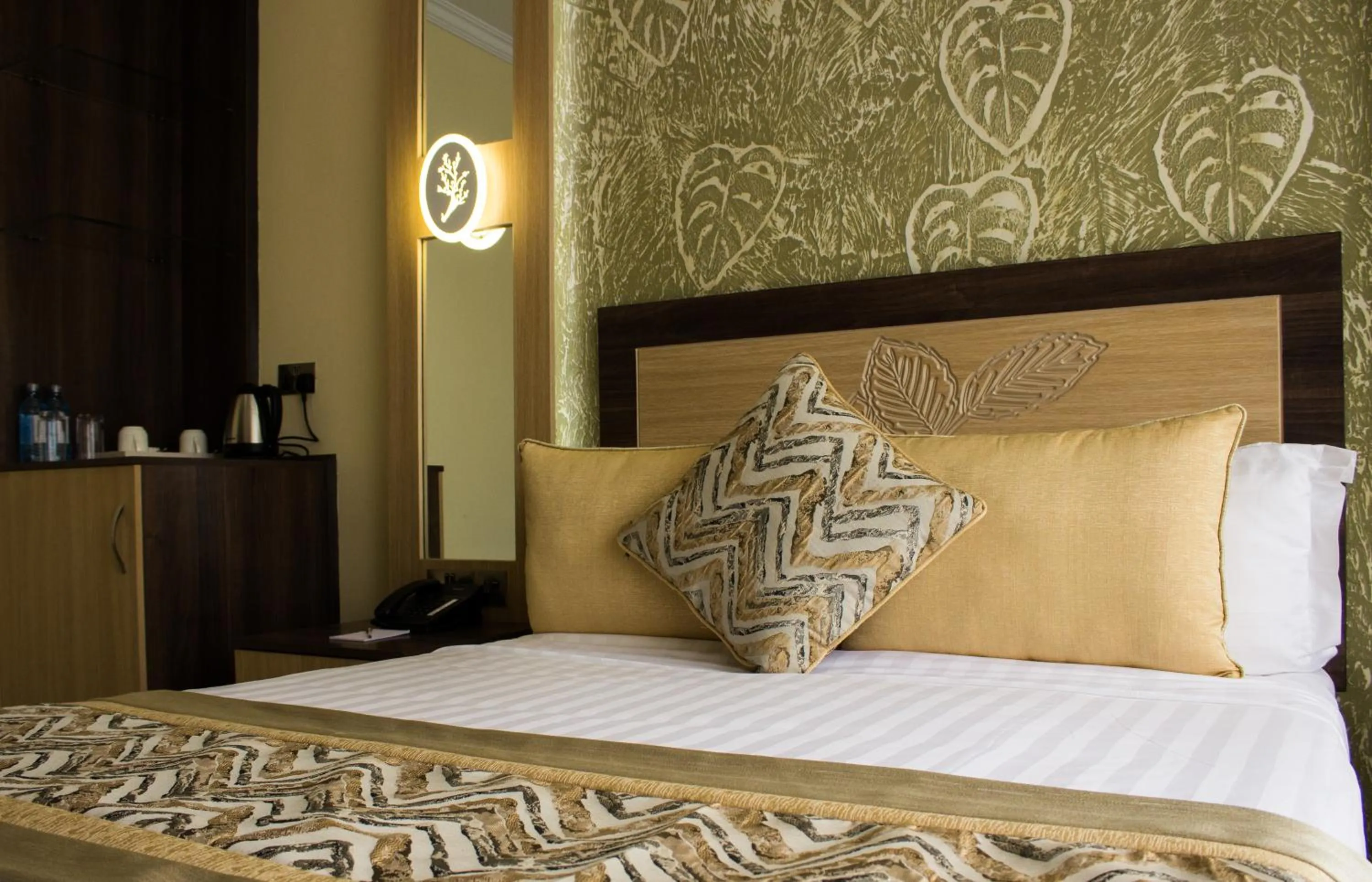 Bed in Elysian Resort