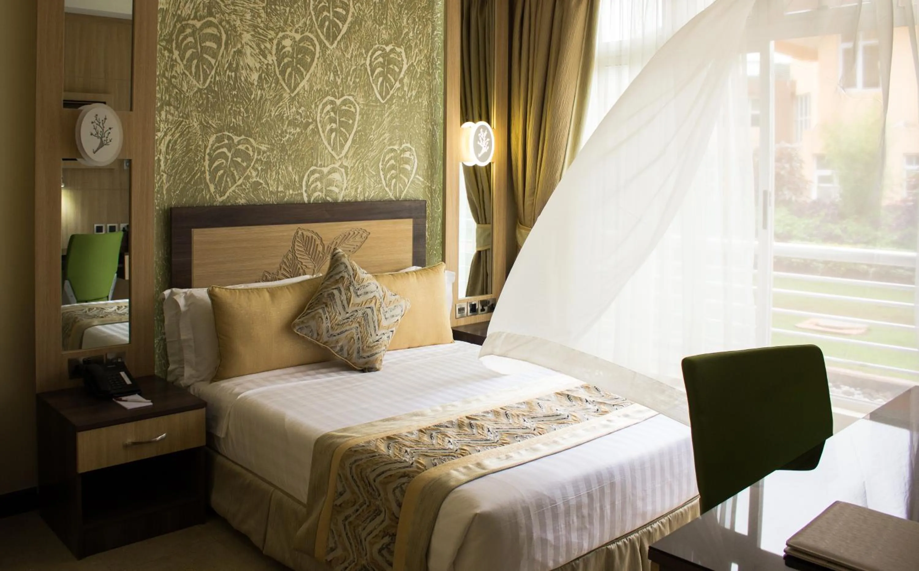 Bed in Elysian Resort