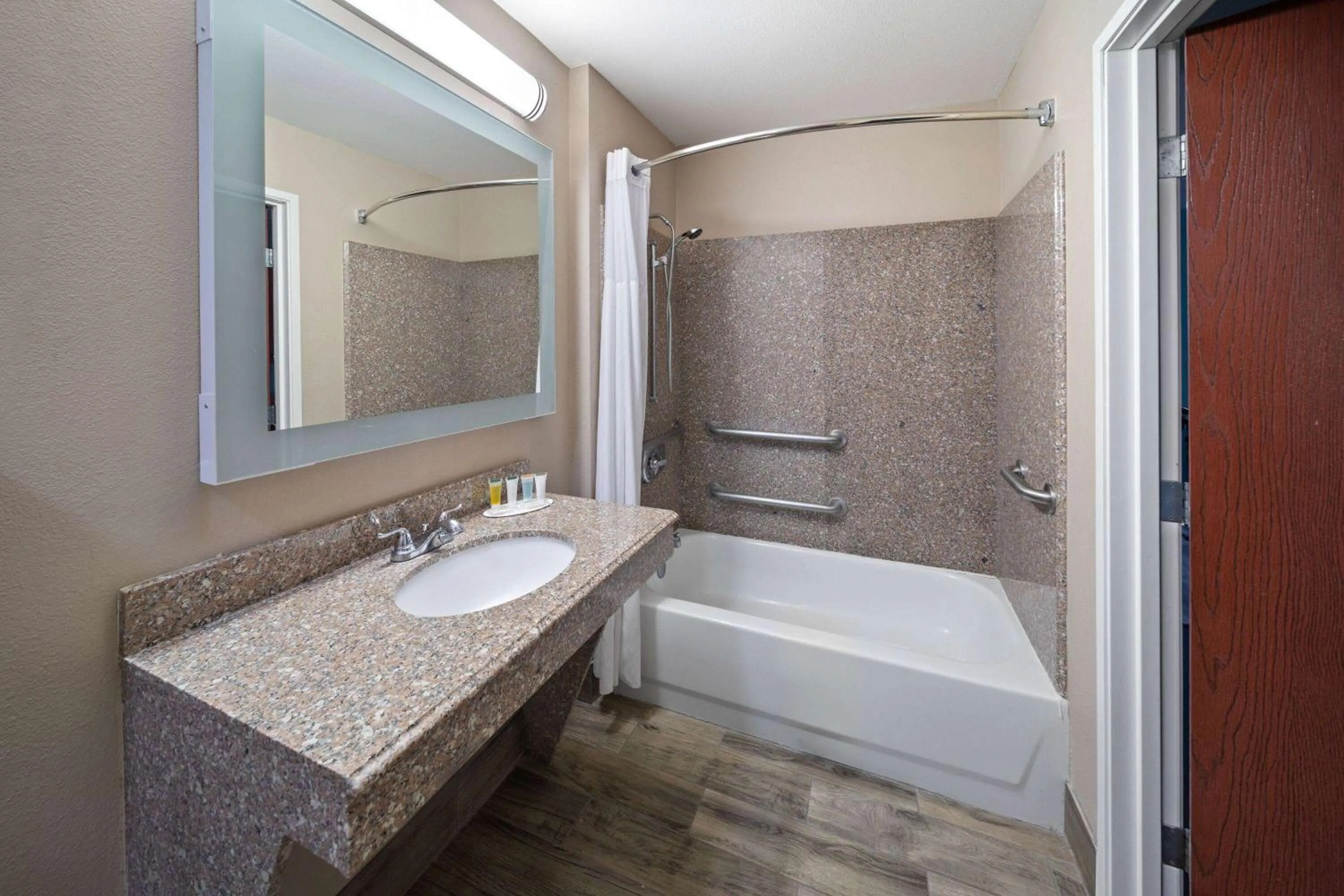 Bathroom in Super 8 by Wyndham Lubbock West