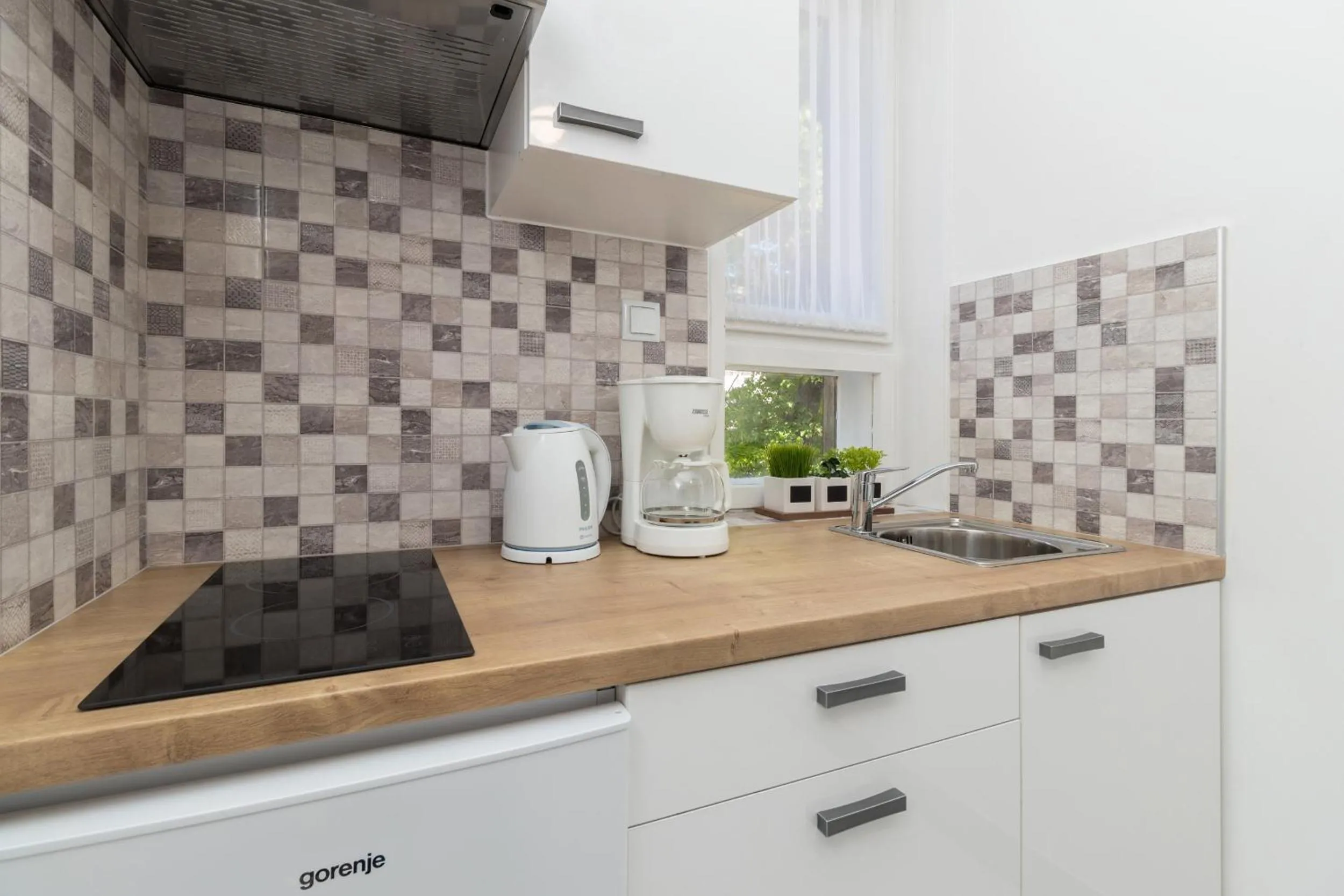Kitchen or kitchenette in Deluxe suite Navis