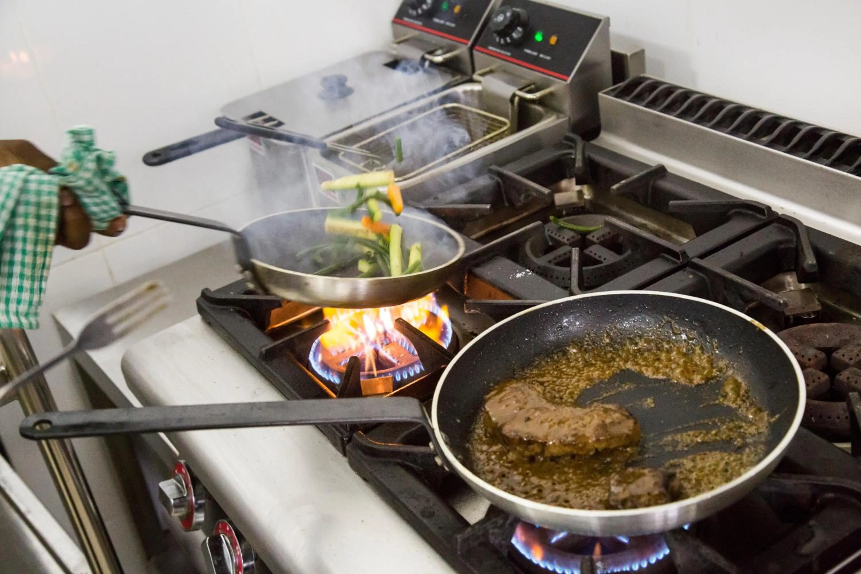 Kitchen or kitchenette in Spice Palace Hotel