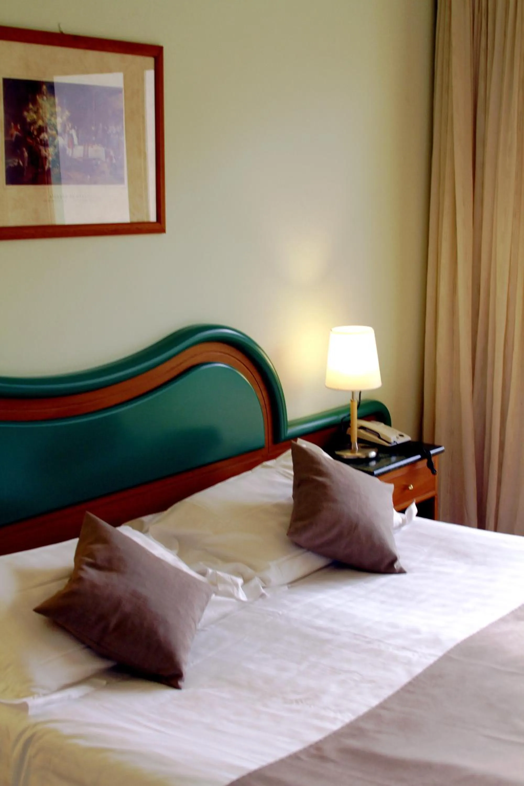 Bed in La Fonte Hotel