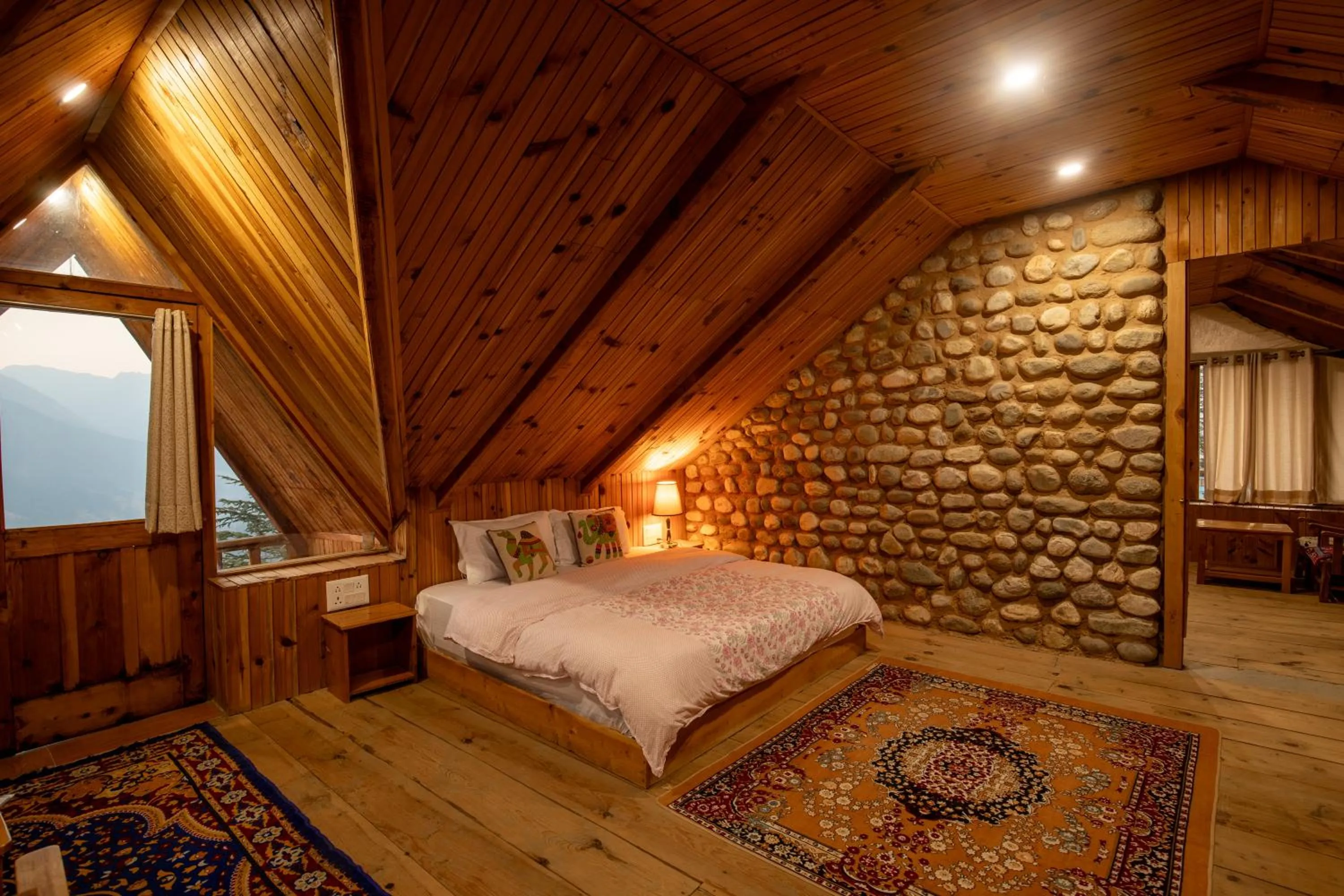 Bed in Ishan Log Huts-A boutique home stay