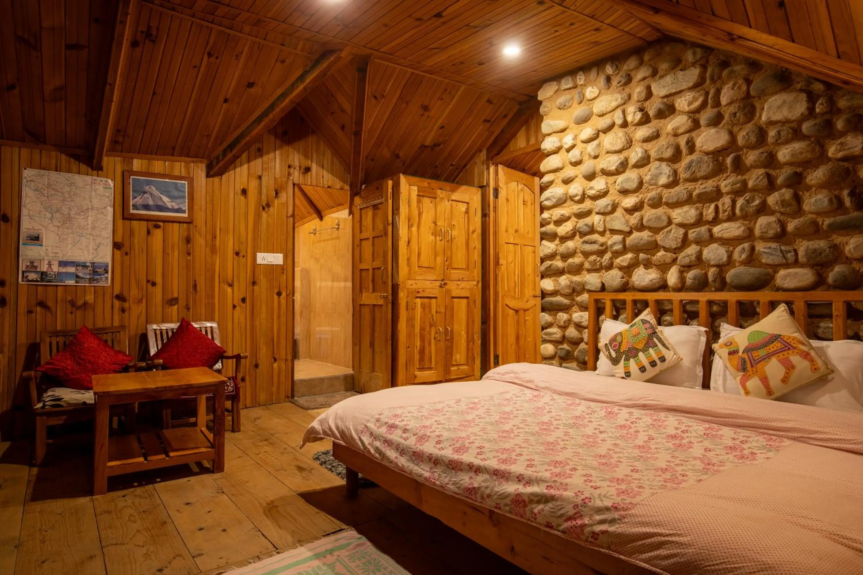 Bed in Ishan Log Huts-A boutique home stay