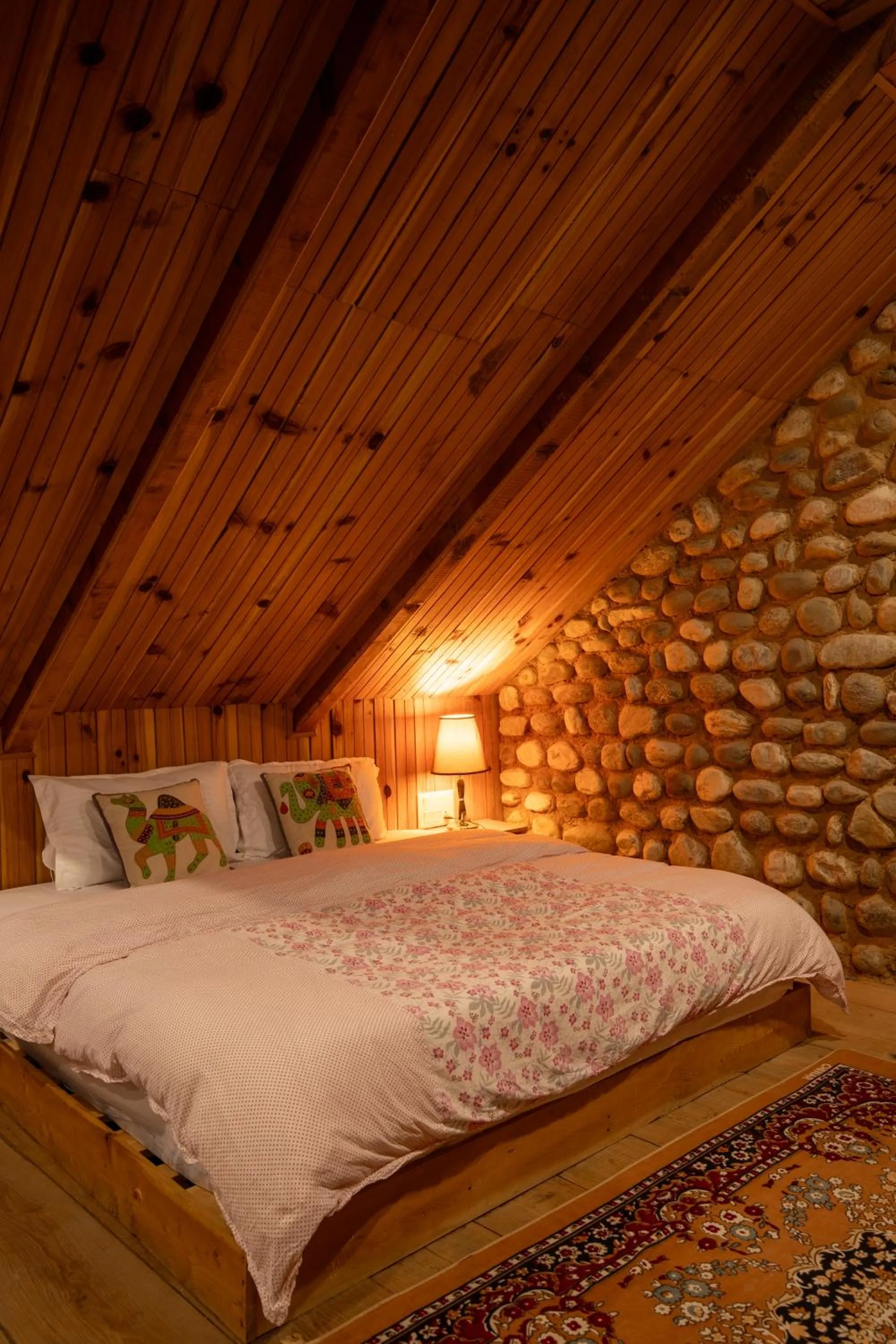 Bed in Ishan Log Huts-A boutique home stay