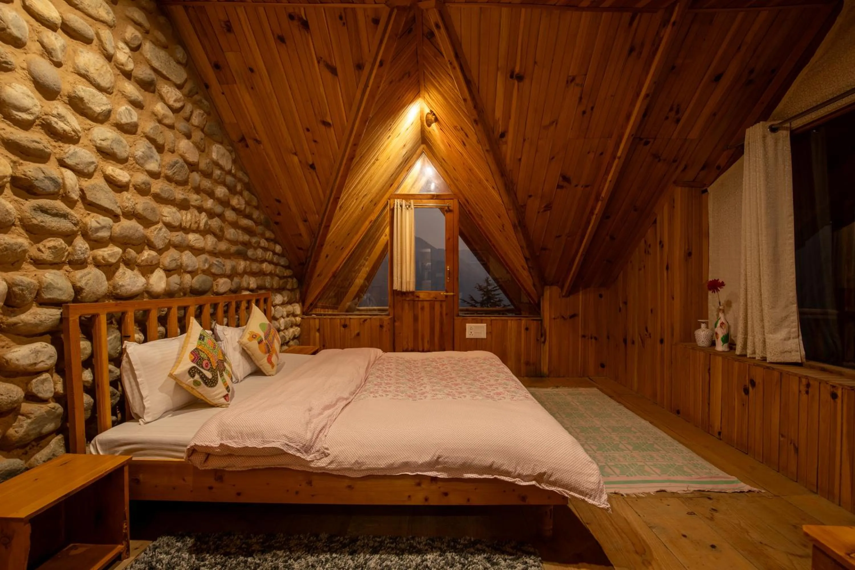 Bed in Ishan Log Huts-A boutique home stay