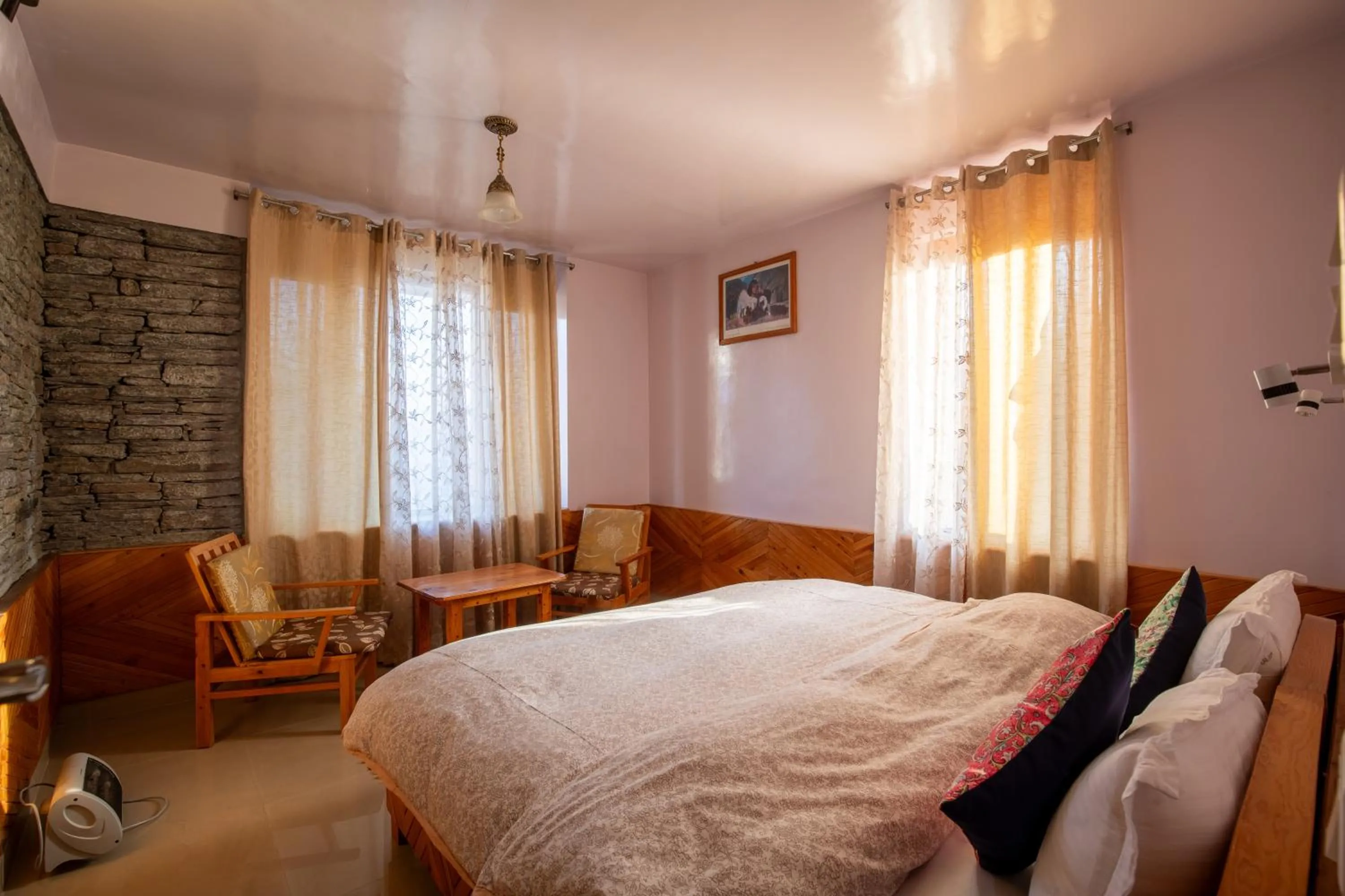 Bed in Ishan Log Huts-A boutique home stay