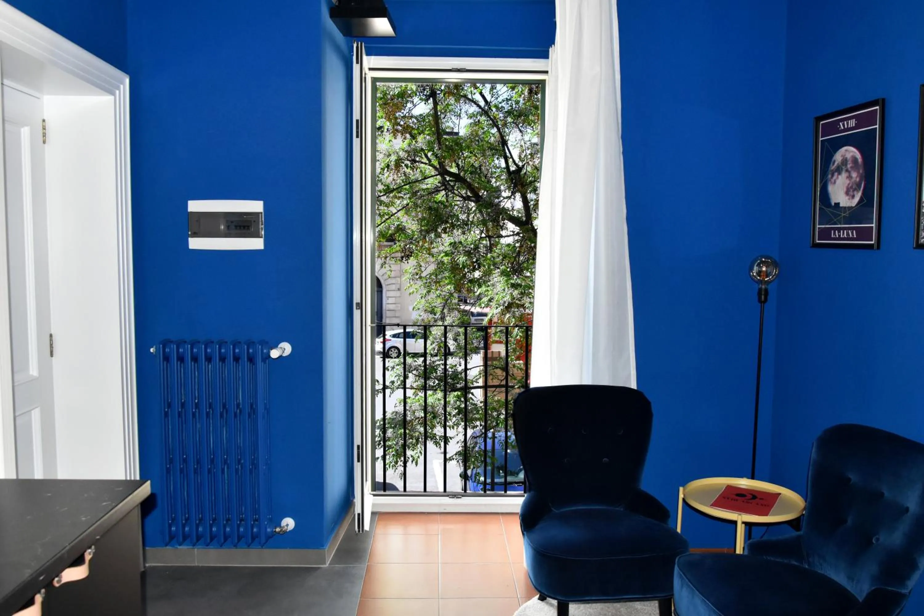 Communal lounge/ TV room in XVIII Arcano