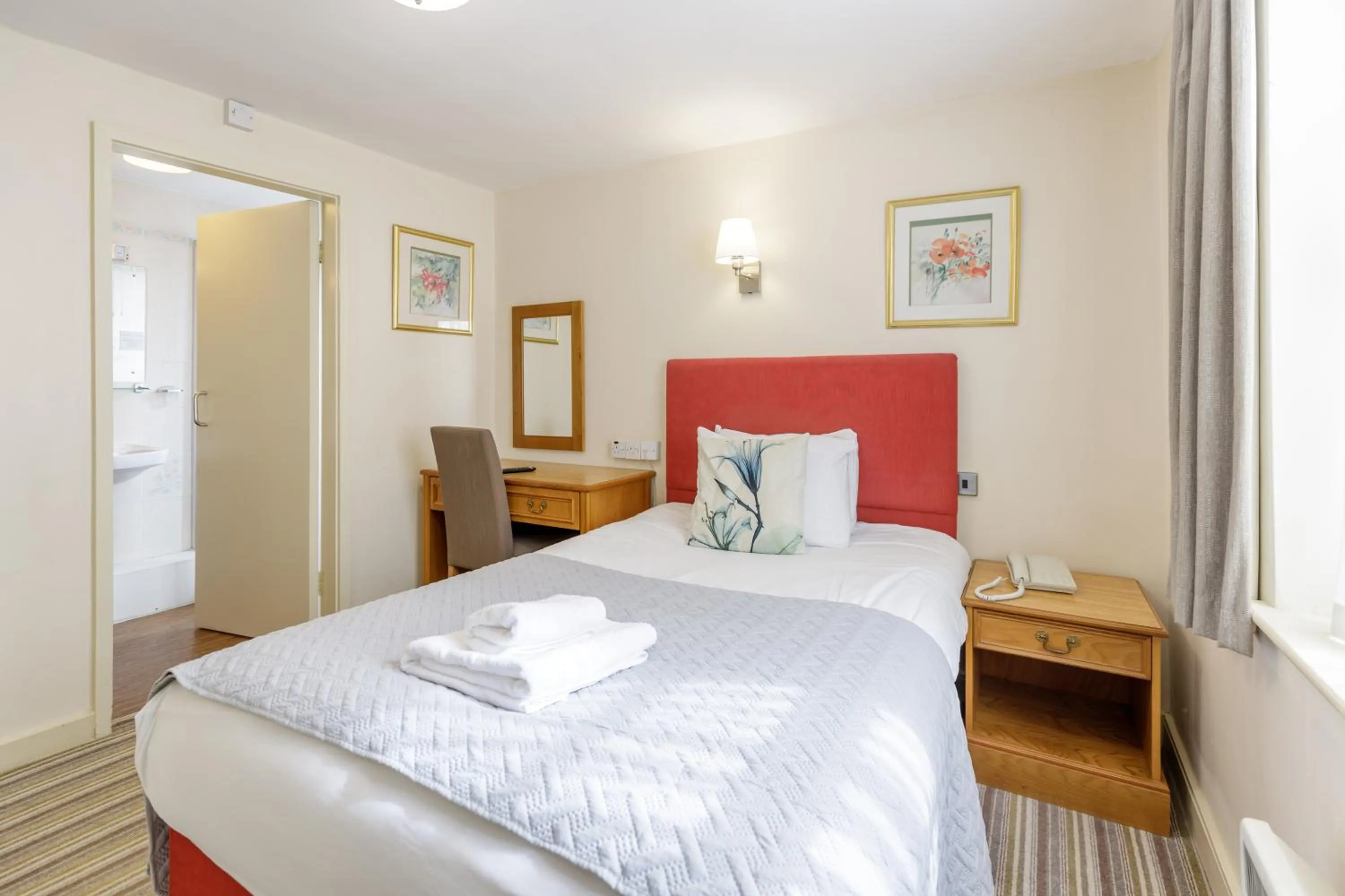 Bed in Swan Revived Hotel