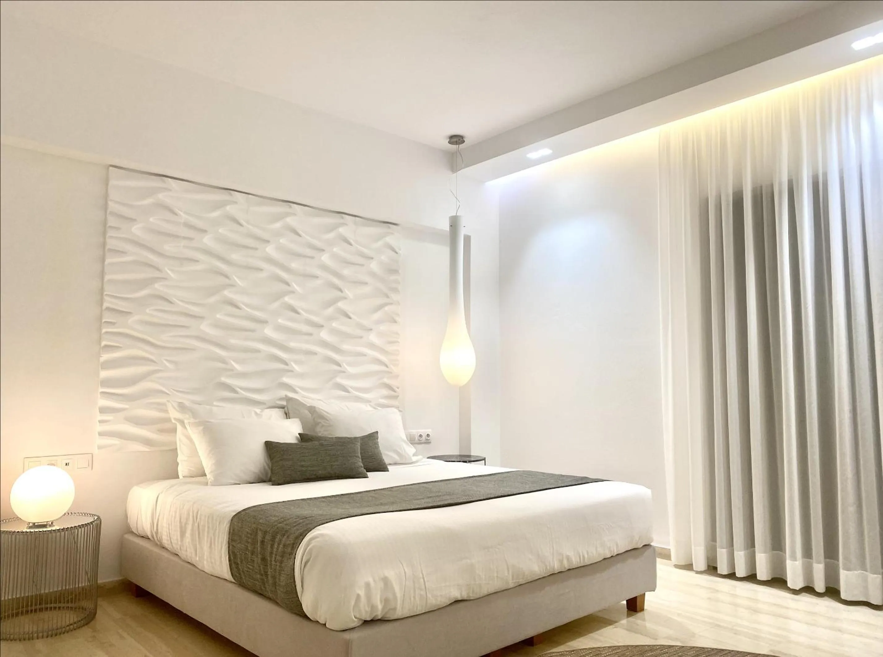 Bed in IONIAN SUITES by Bruskos