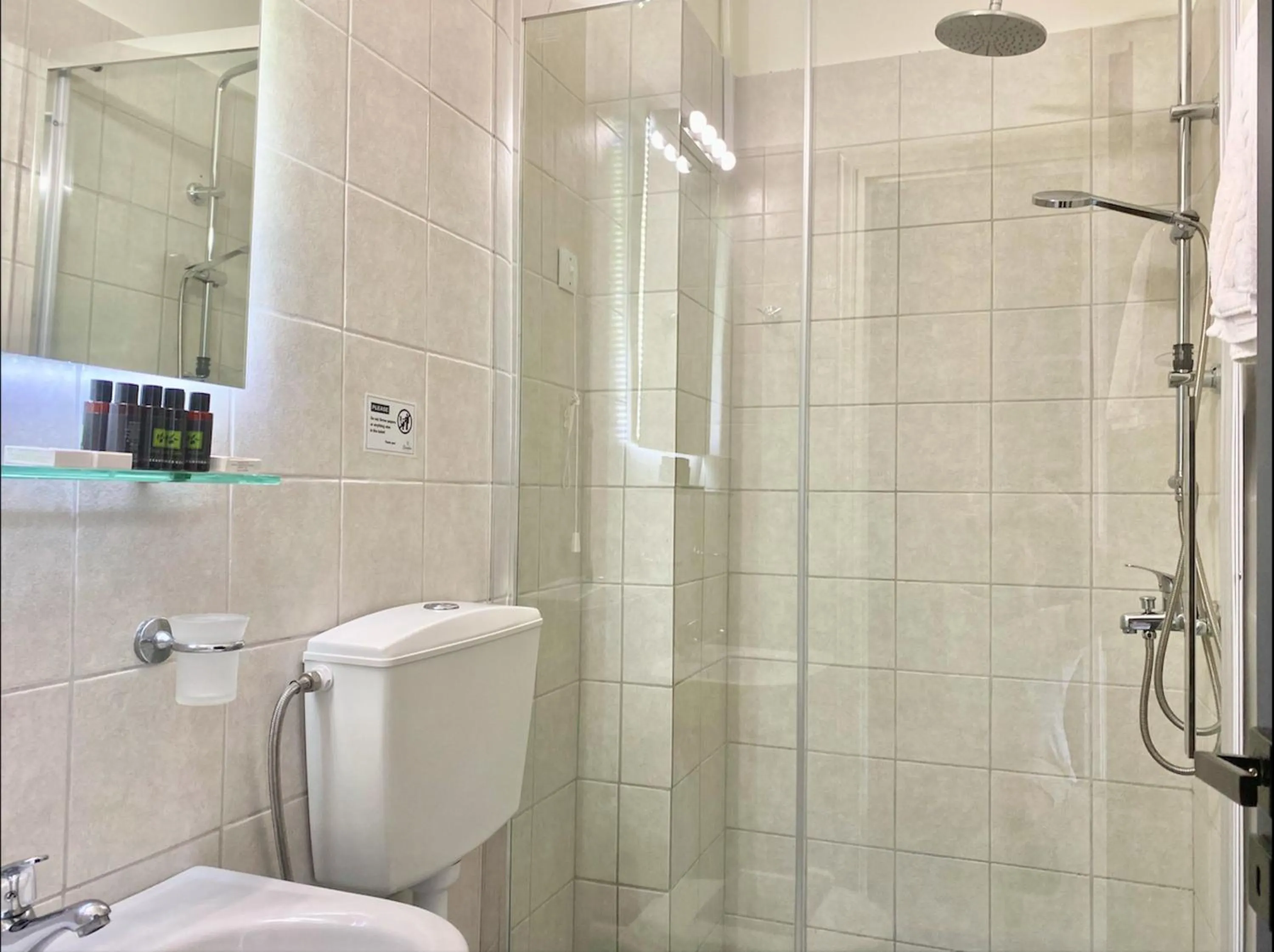 Bathroom in IONIAN SUITES by Bruskos