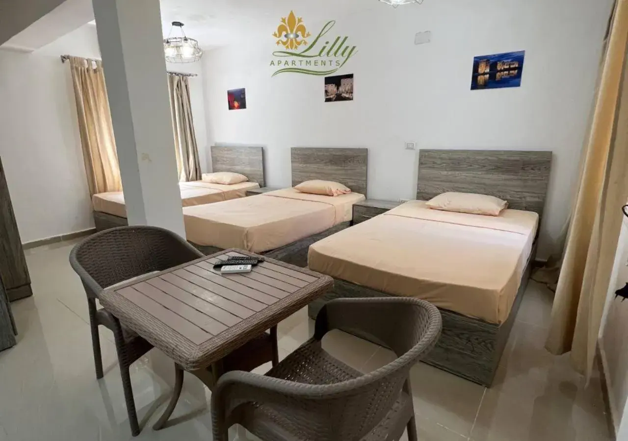 Triple Room with Garden View in Lilly Rooms and Studio Triple Room with Garden View in Lilly Rooms and Studio