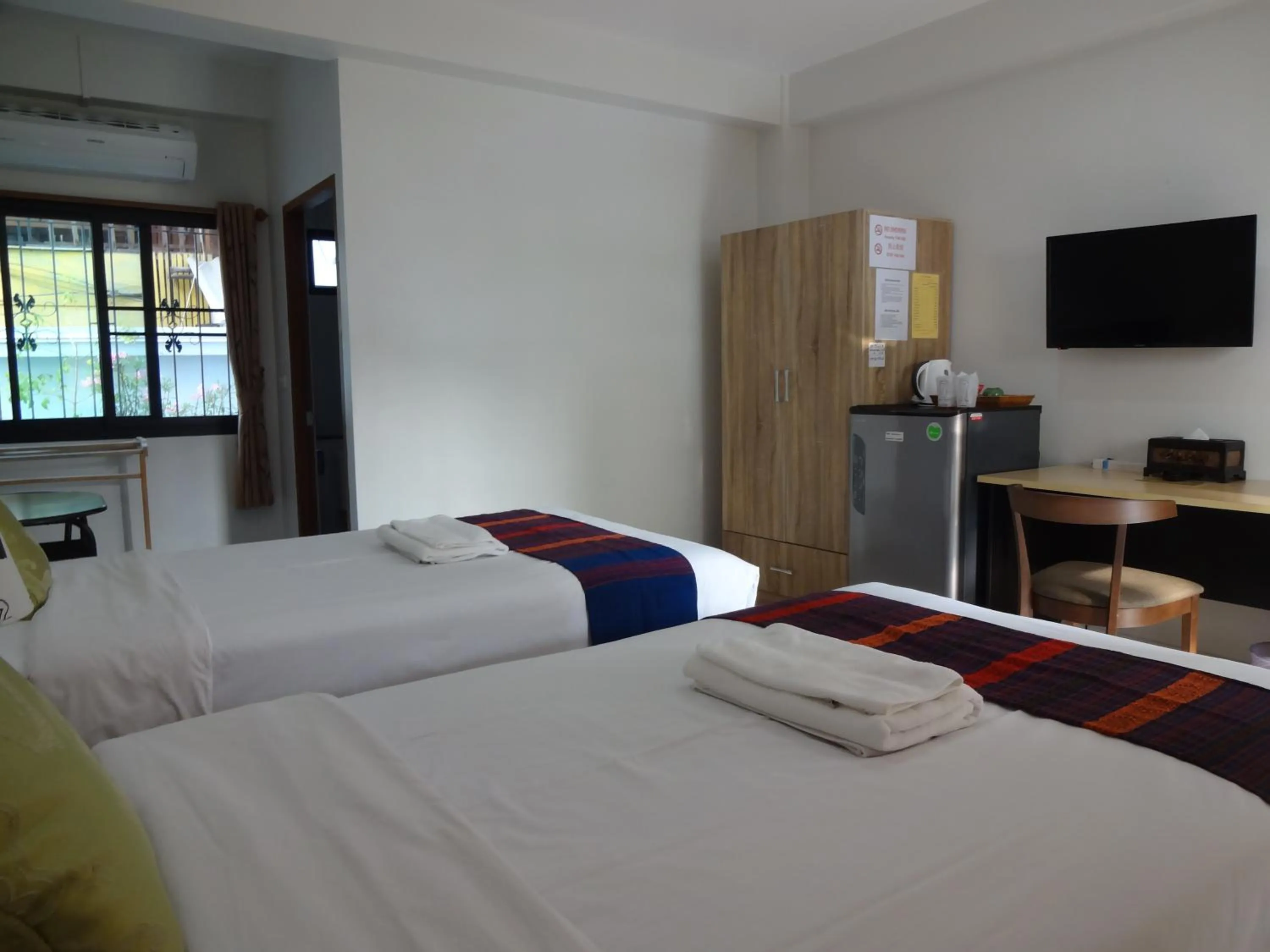 Photo of the whole room, Bed in Rena House Chiang Mai