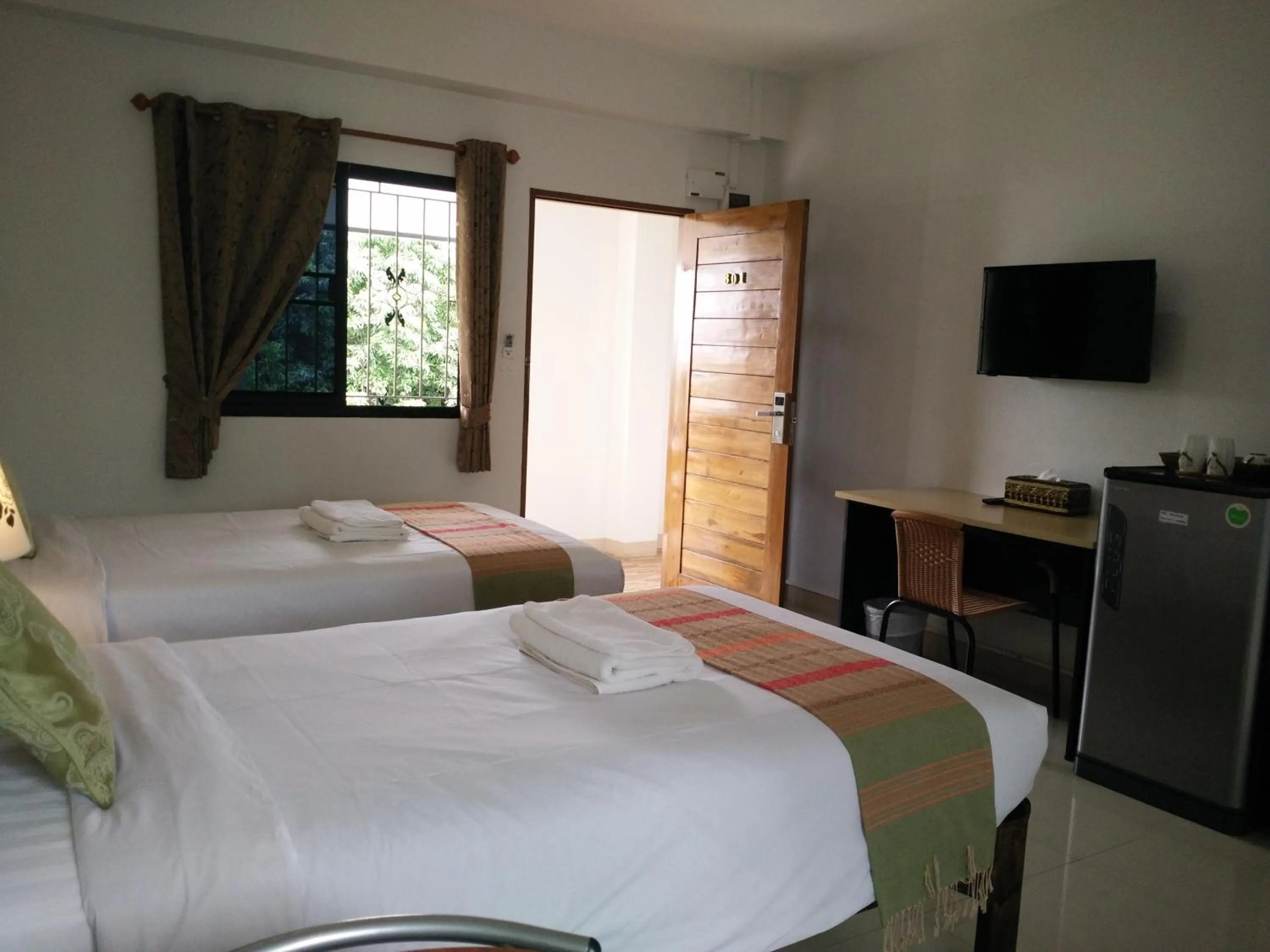 Photo of the whole room, Bed in Rena House Chiang Mai