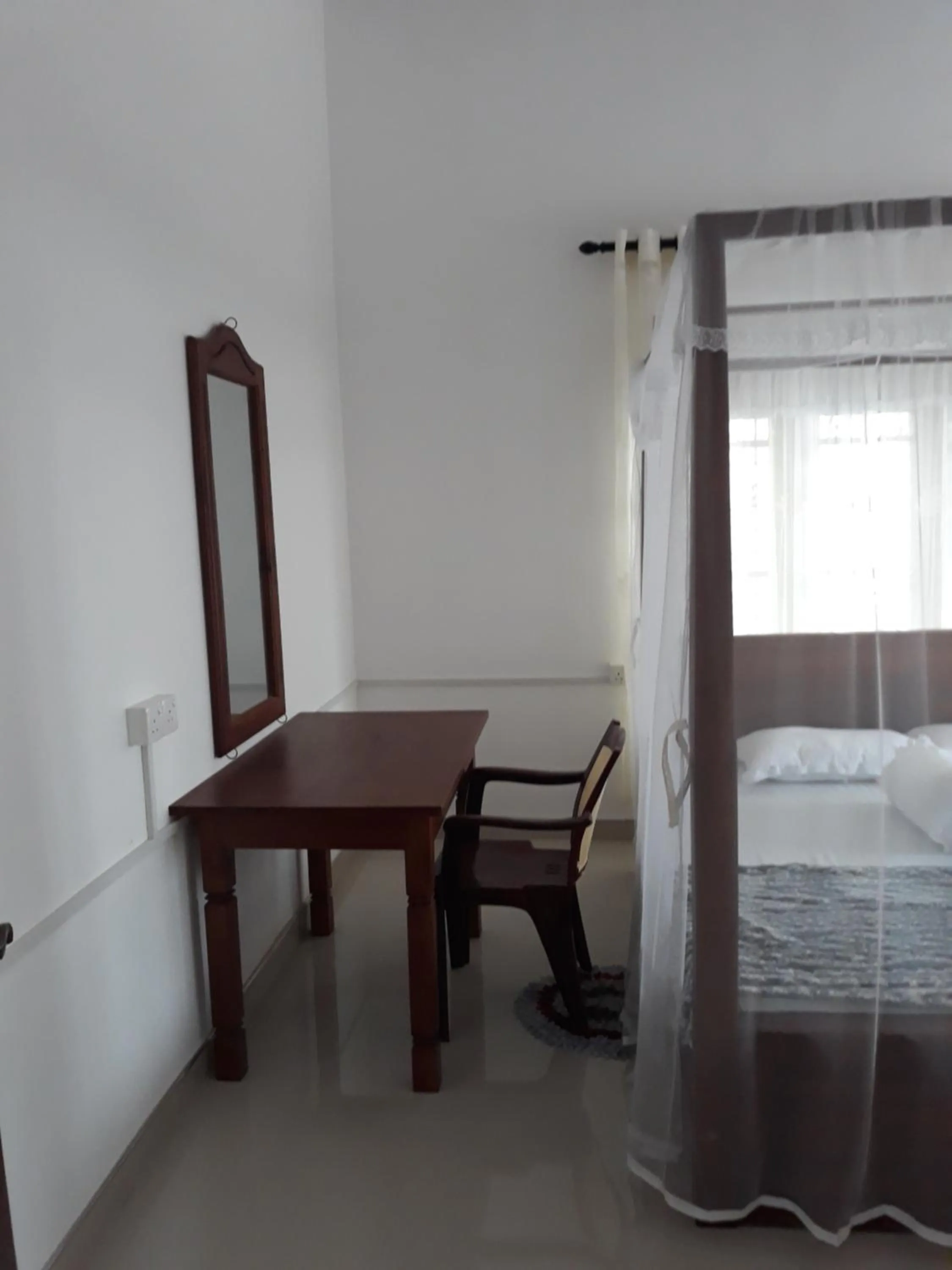 Seating area, Bed in Padmi Villa