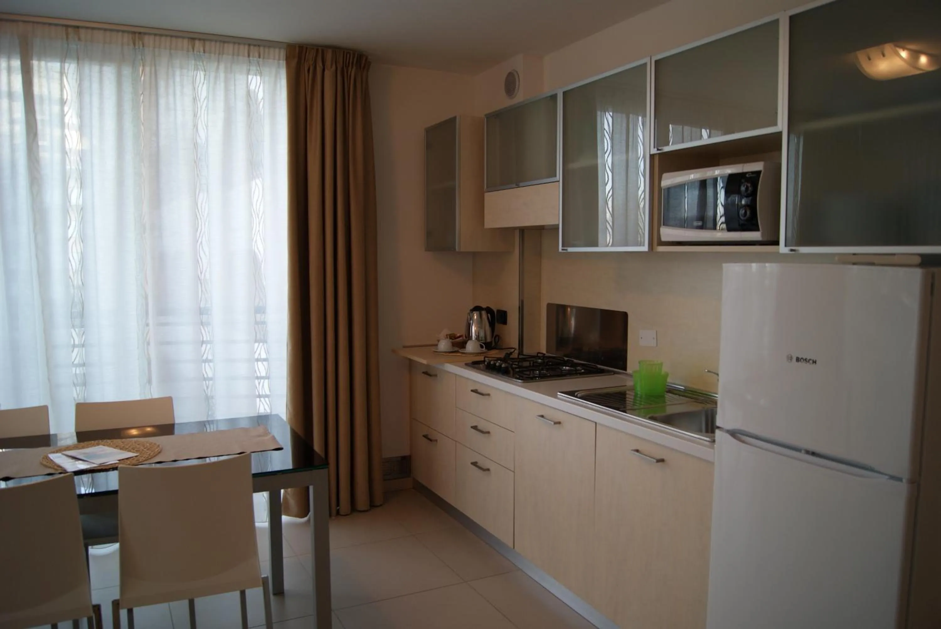 Kitchen or kitchenette in Residence Aprilia