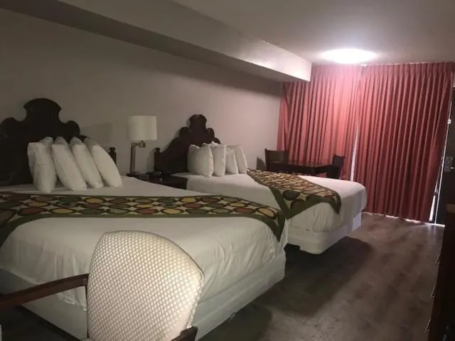 Bed in Alamar Resort Inn