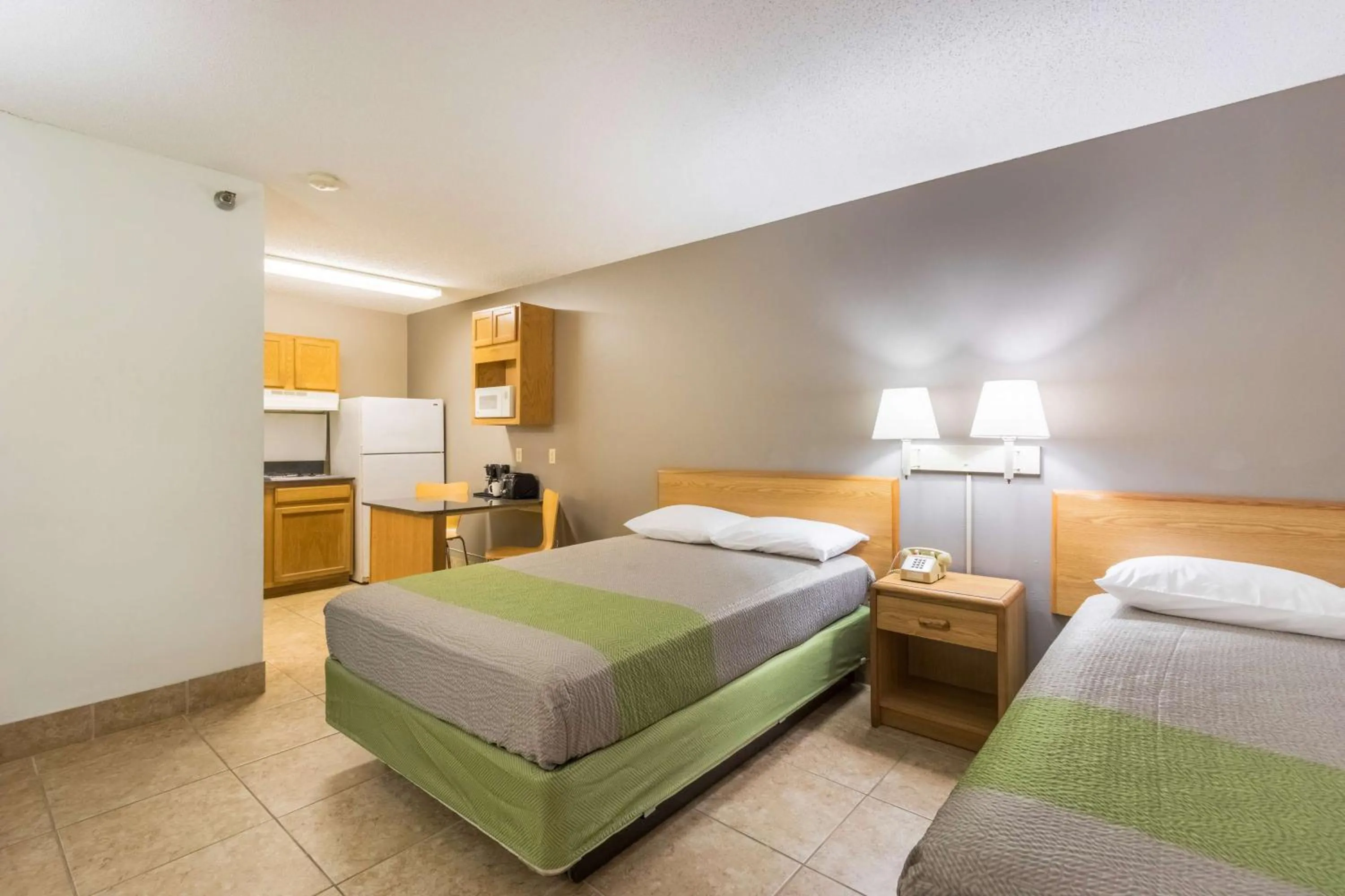 Kitchen or kitchenette, Bed in Studio 6-Statesboro, GA