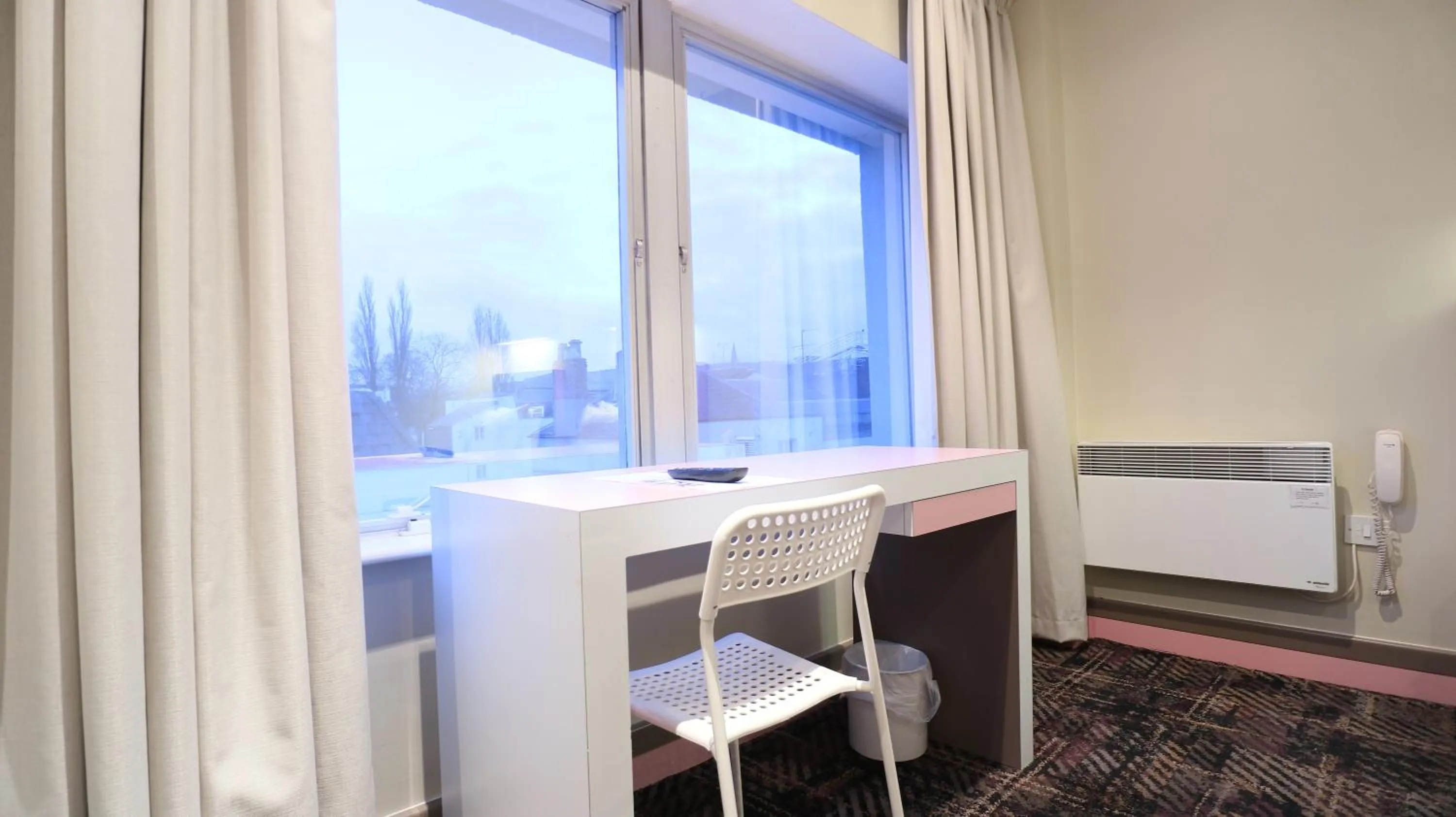 Seating area in Citrus Hotel Cheltenham by Compass Hospitality