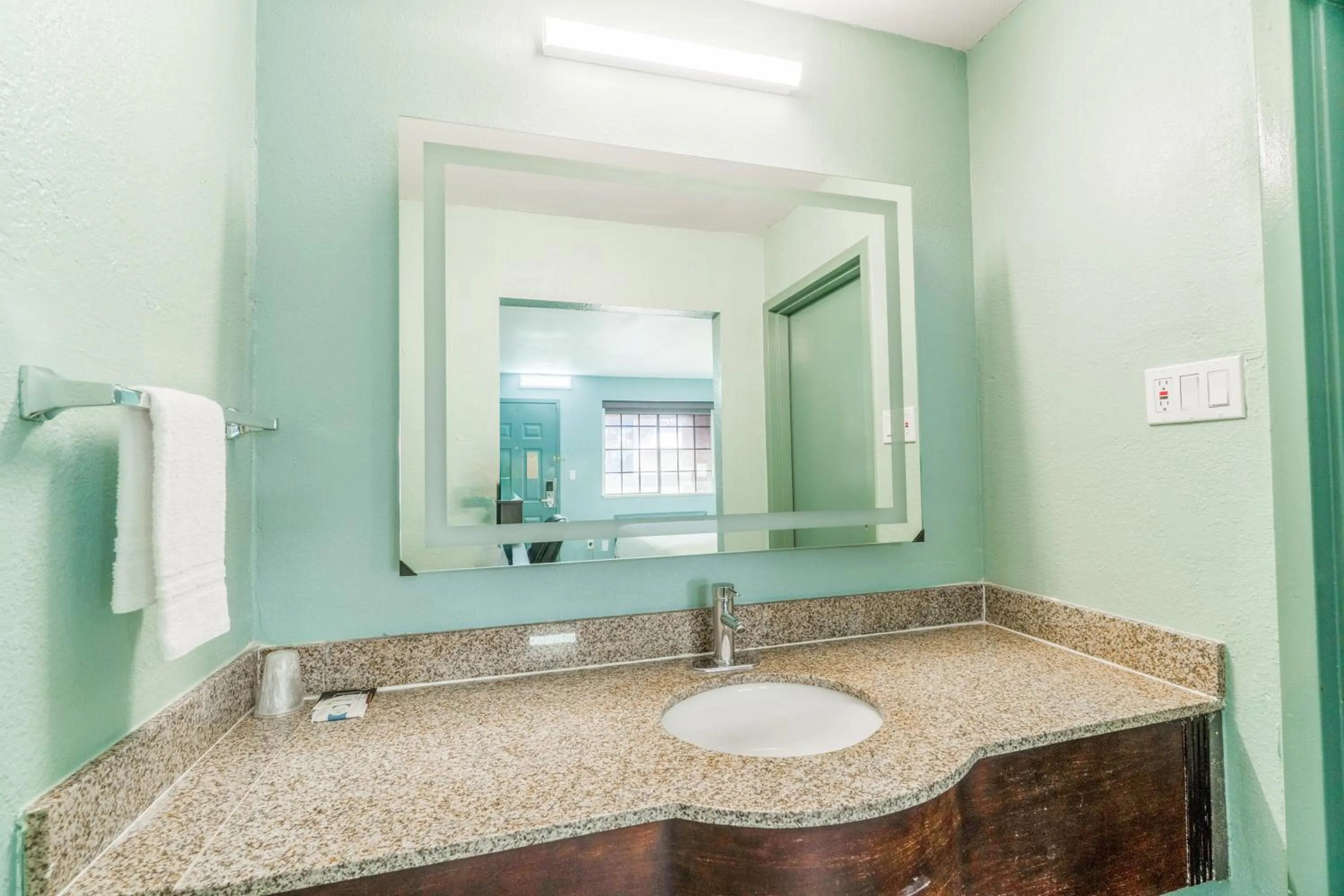 Bathroom in Lone Star Inn & Suites by OYO Harlingen TX