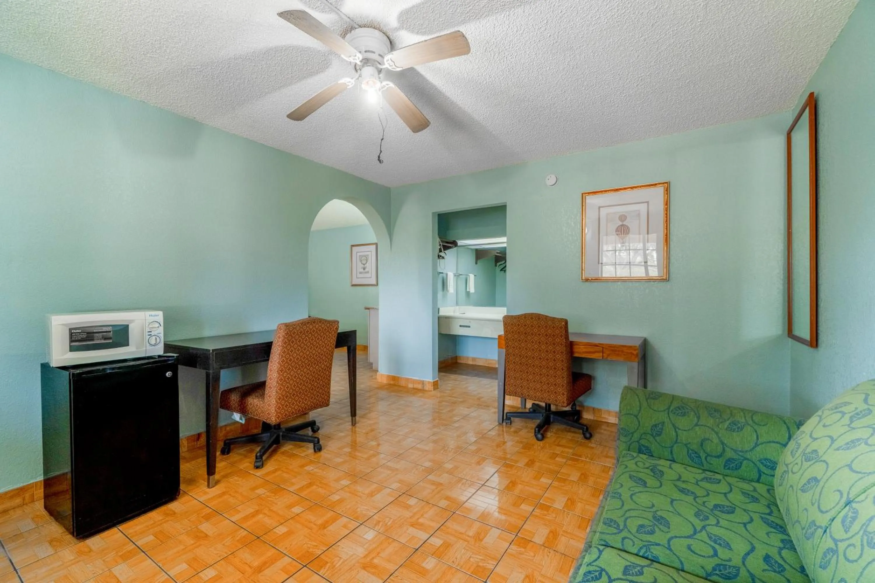 Seating area in Lone Star Inn & Suites by OYO Harlingen TX