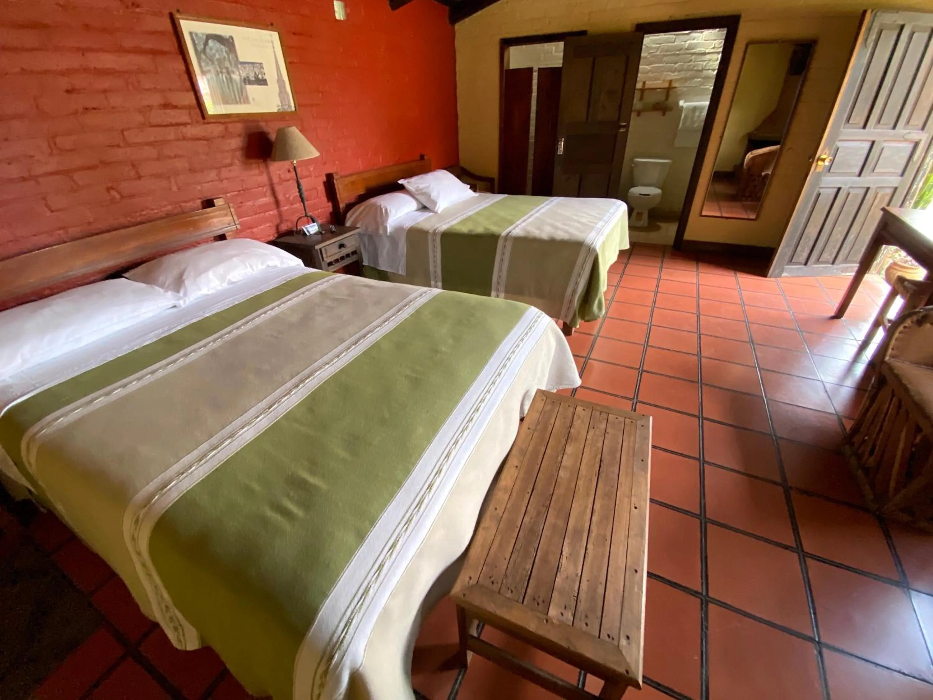 Bed in Villa Patzcuaro Garden Hotel
