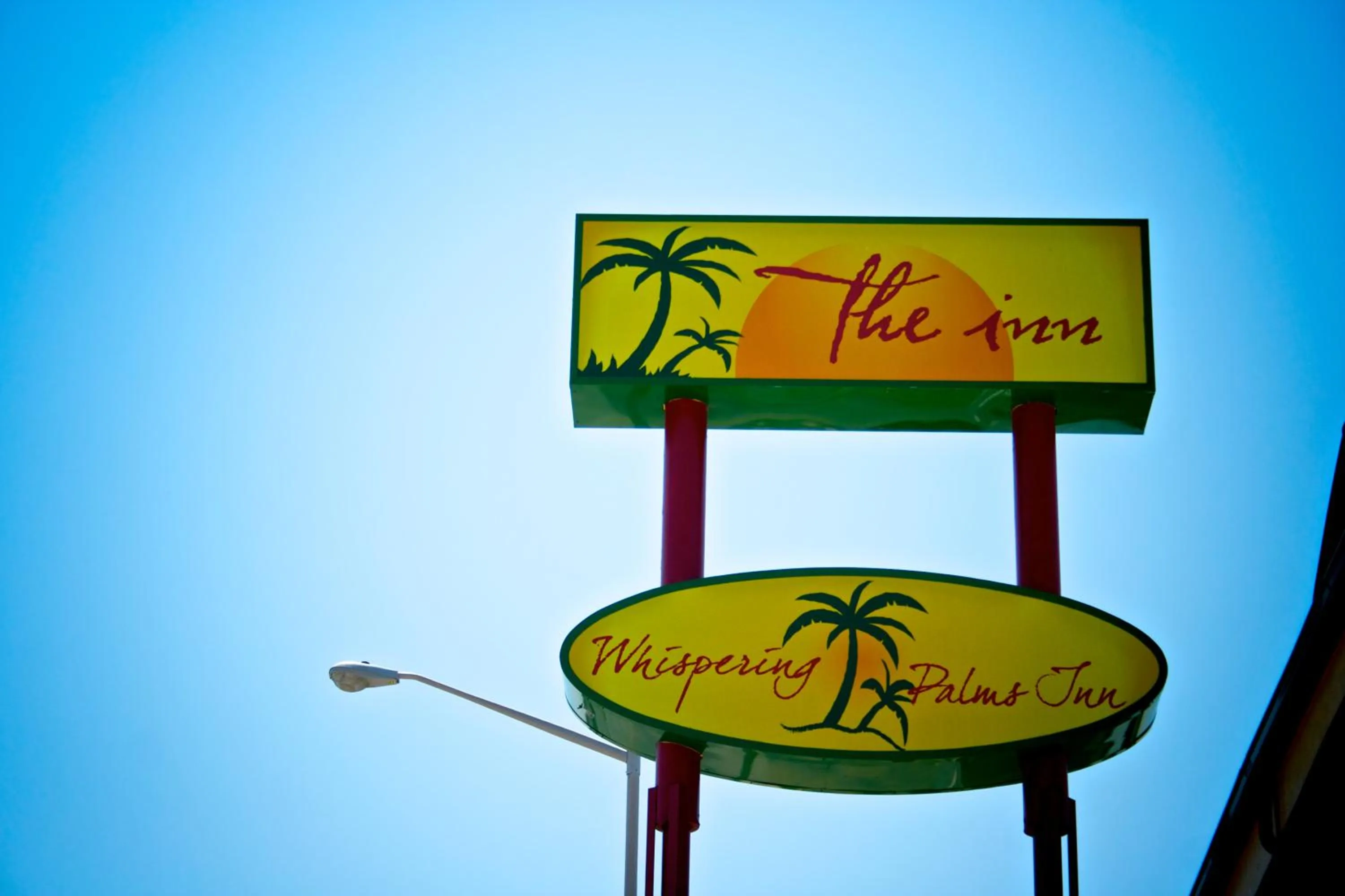 Logo/Certificate/Sign in Whispering Palms Inn