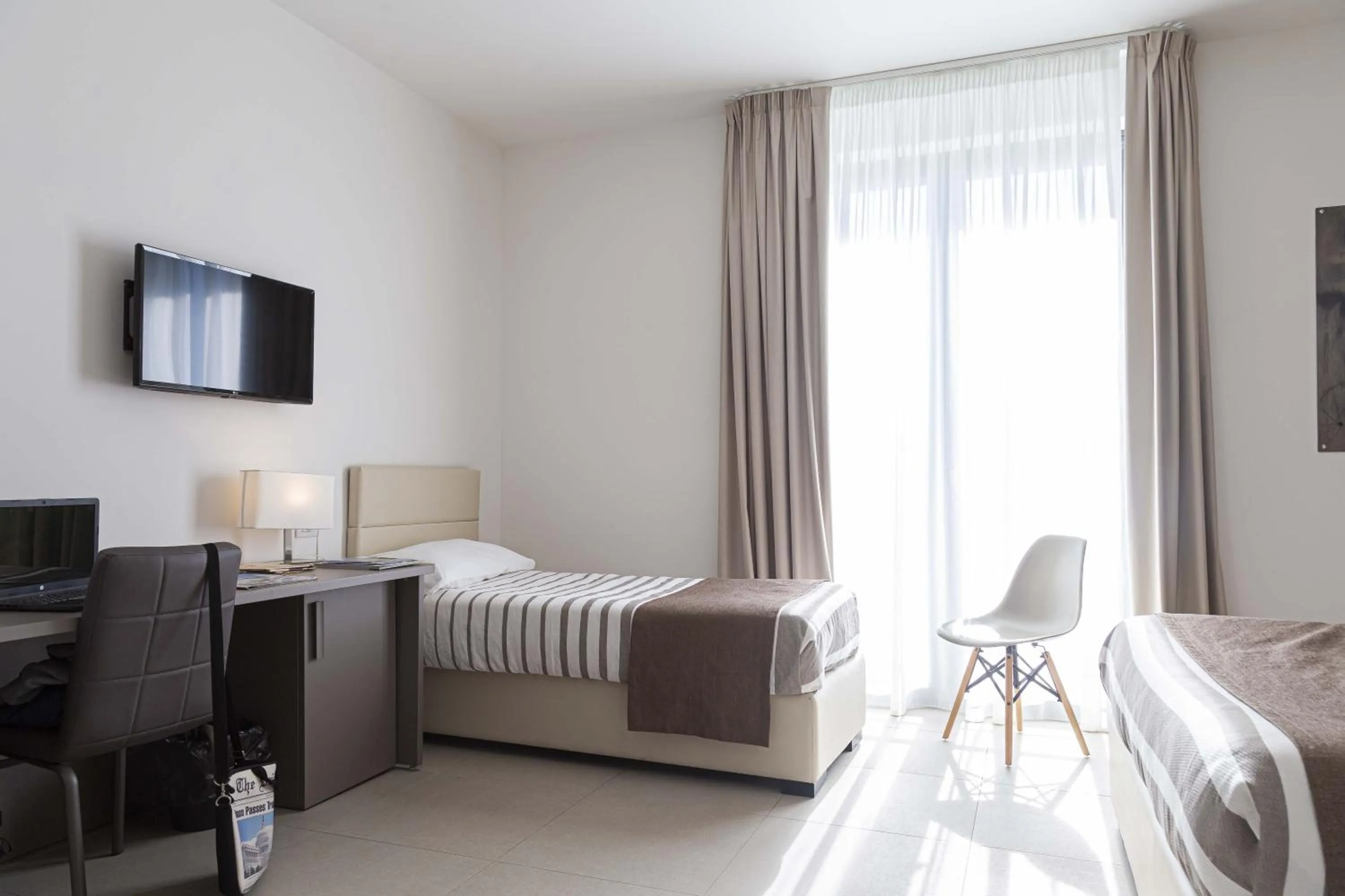 Bed in Moma Hotel Wellness & Spa