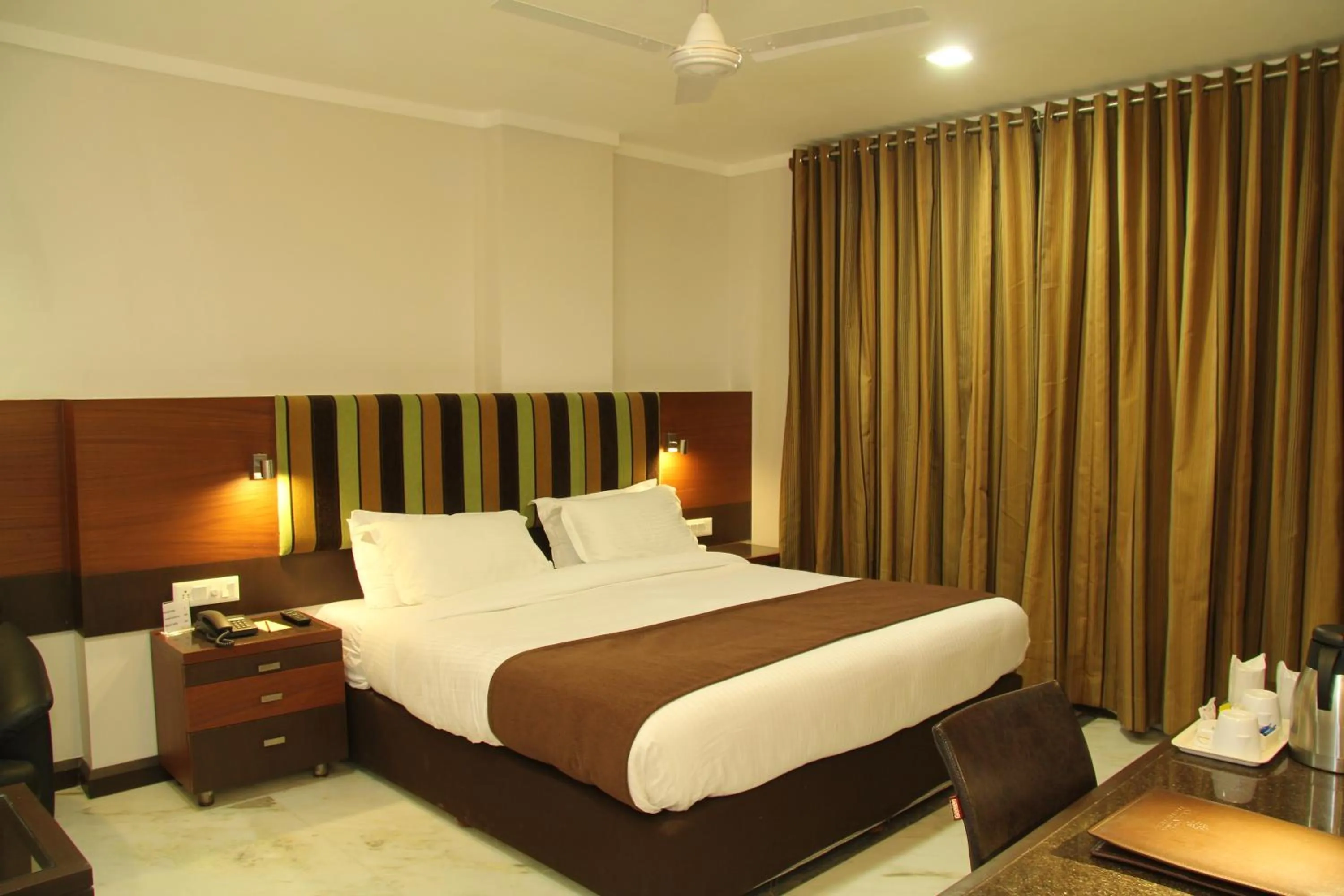 Bed in Amantra Comfort Hotel