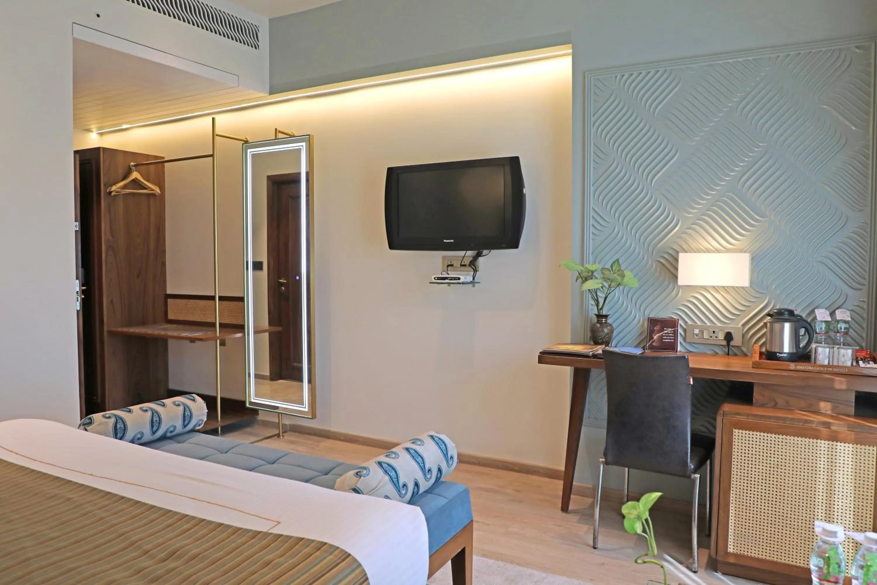 Bed in Amantra Comfort Hotel