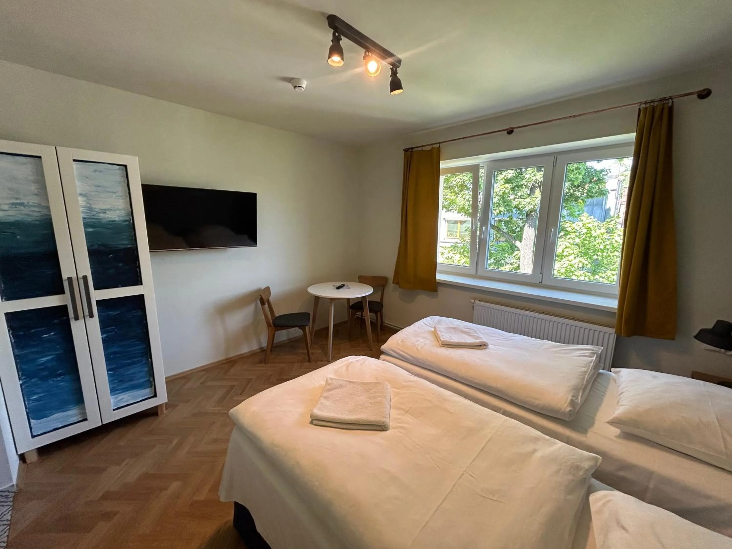 Bed in Cybulskiego Guest Rooms