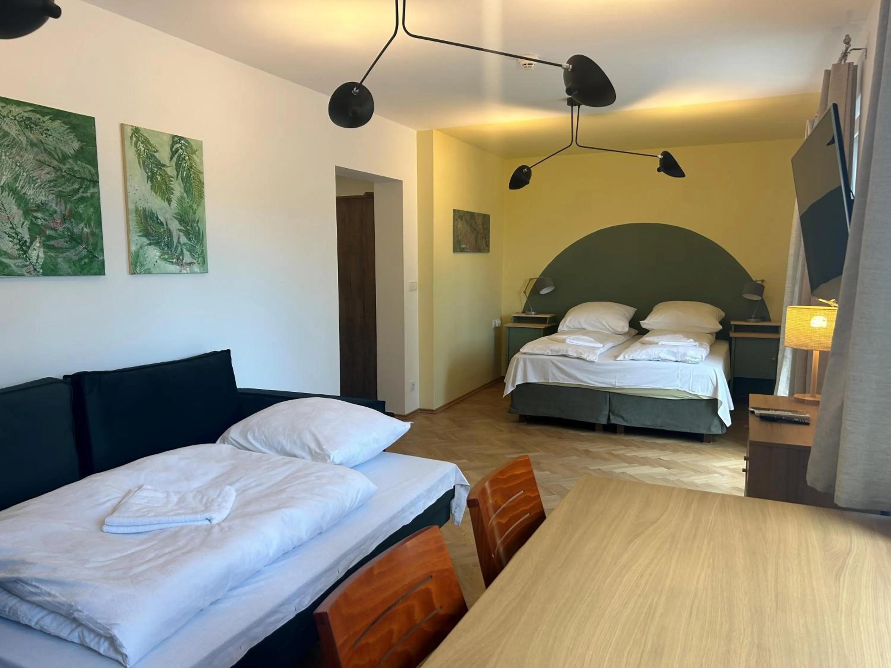 Bed in Cybulskiego Guest Rooms