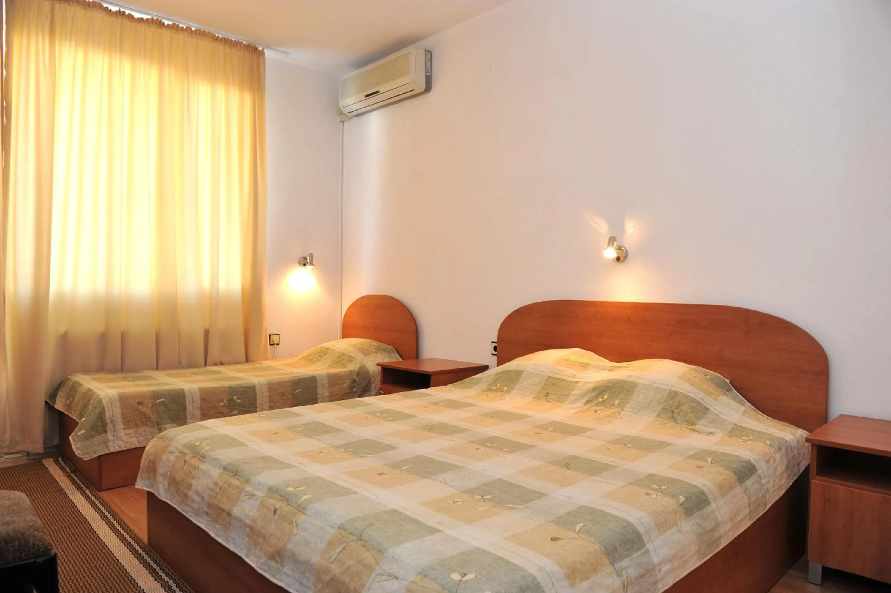 Bed in Family Hotel Blazhi