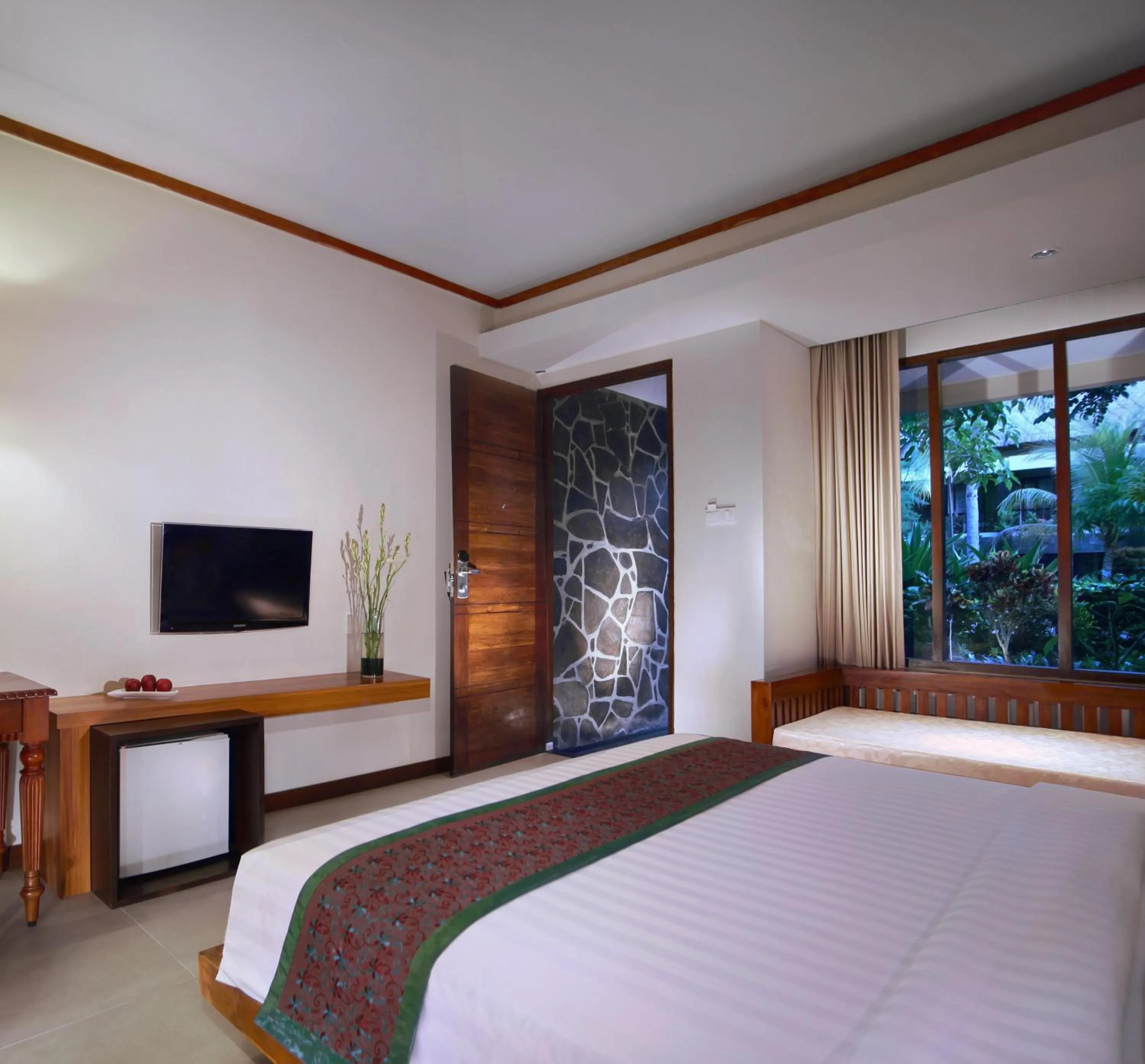 Bedroom, Bed in Aston Sunset Beach Resort - Gili Trawangan