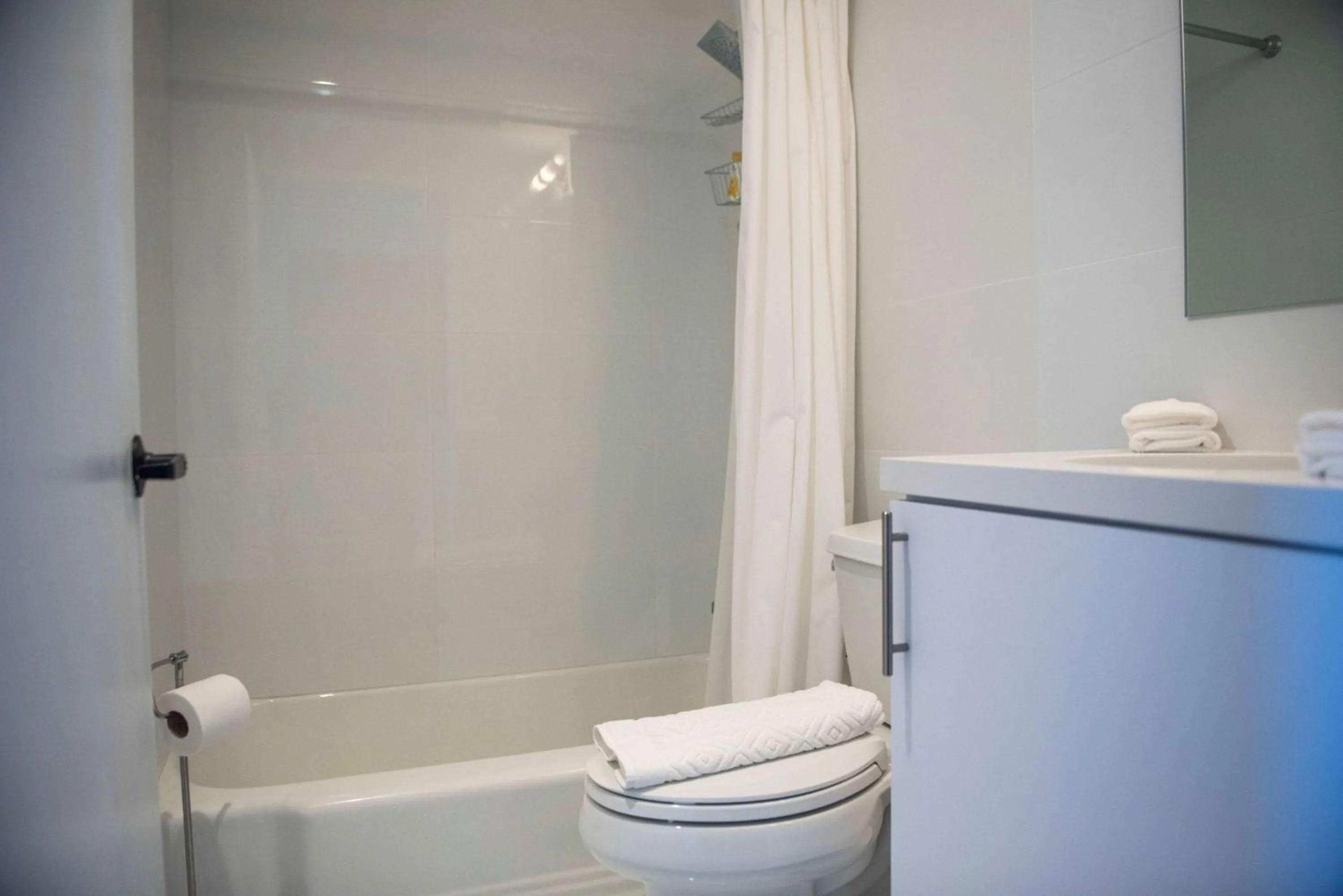 TV and multimedia, Bathroom in 12th & Ocean Suites by LuxUrban