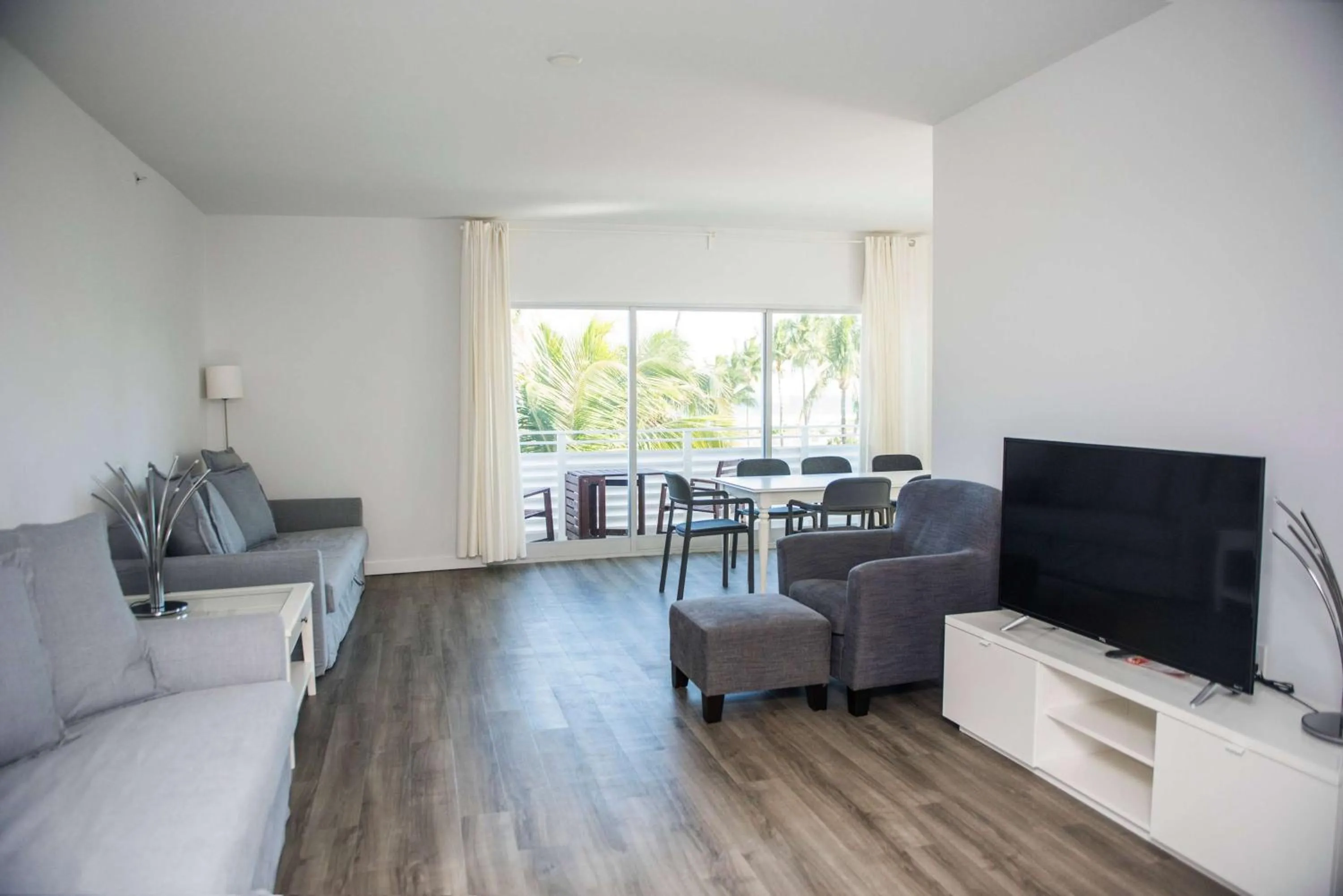 Photo of the whole room, Seating Area in 12th & Ocean Suites by LuxUrban