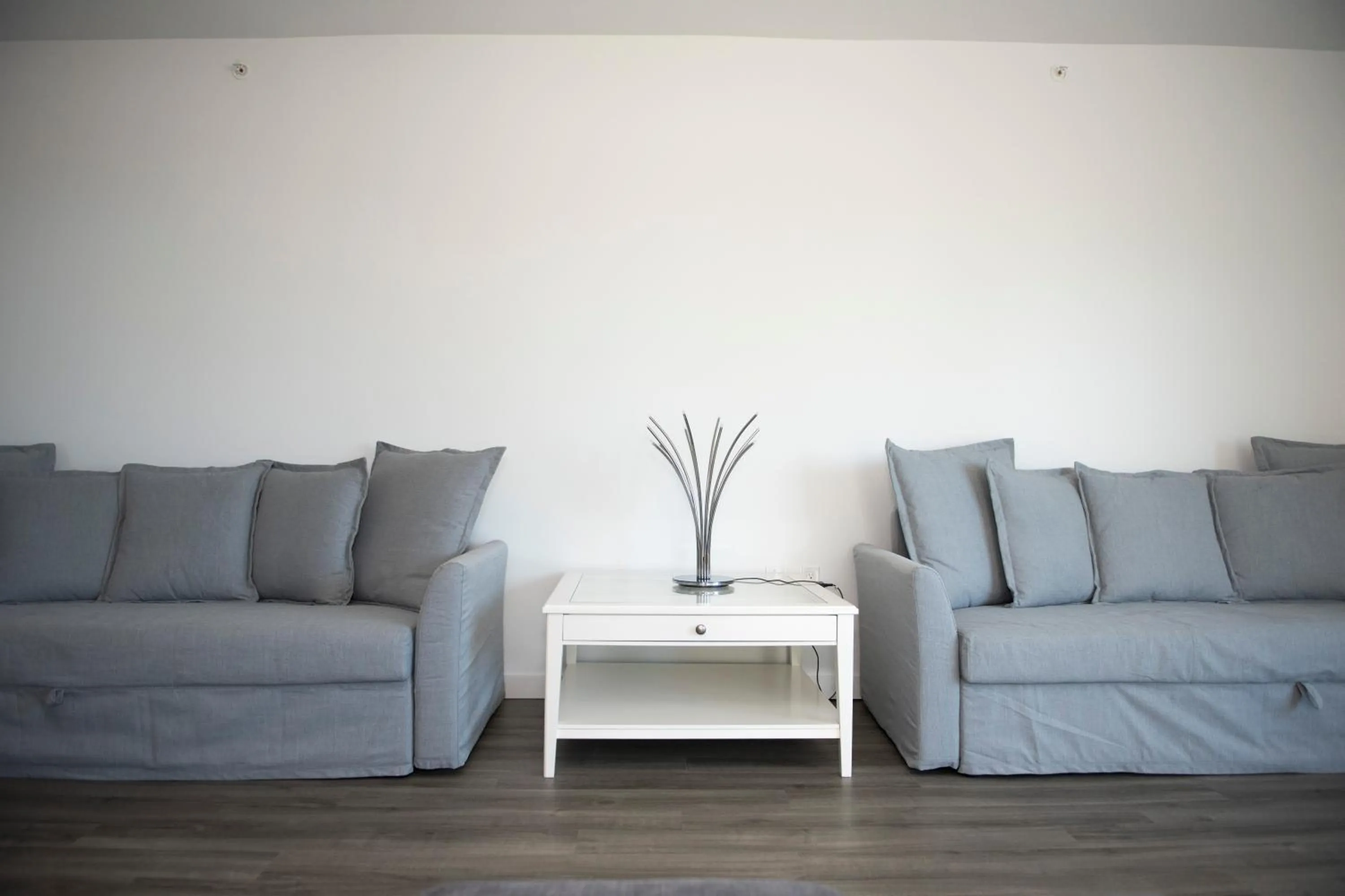 Seating Area in 12th & Ocean Suites by LuxUrban