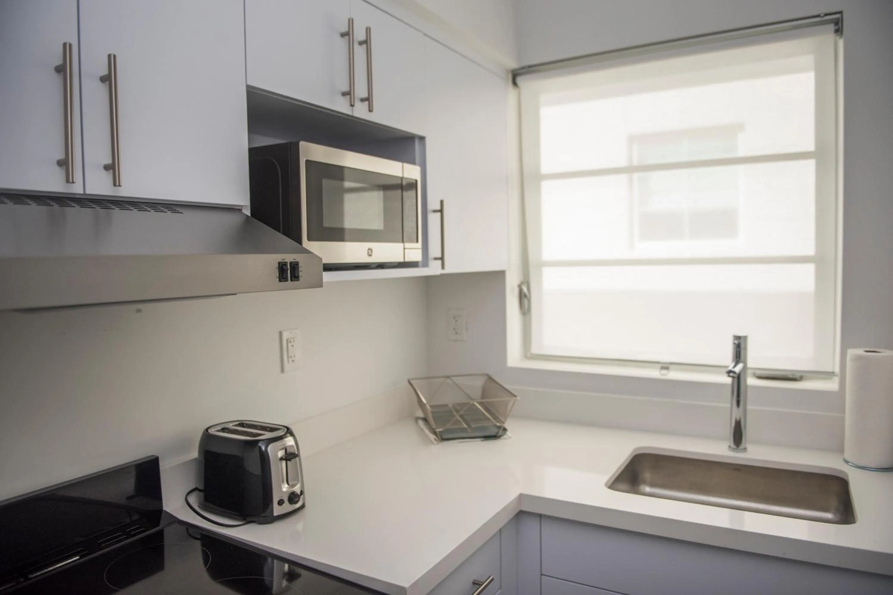 Kitchen/Kitchenette in 12th & Ocean Suites by LuxUrban