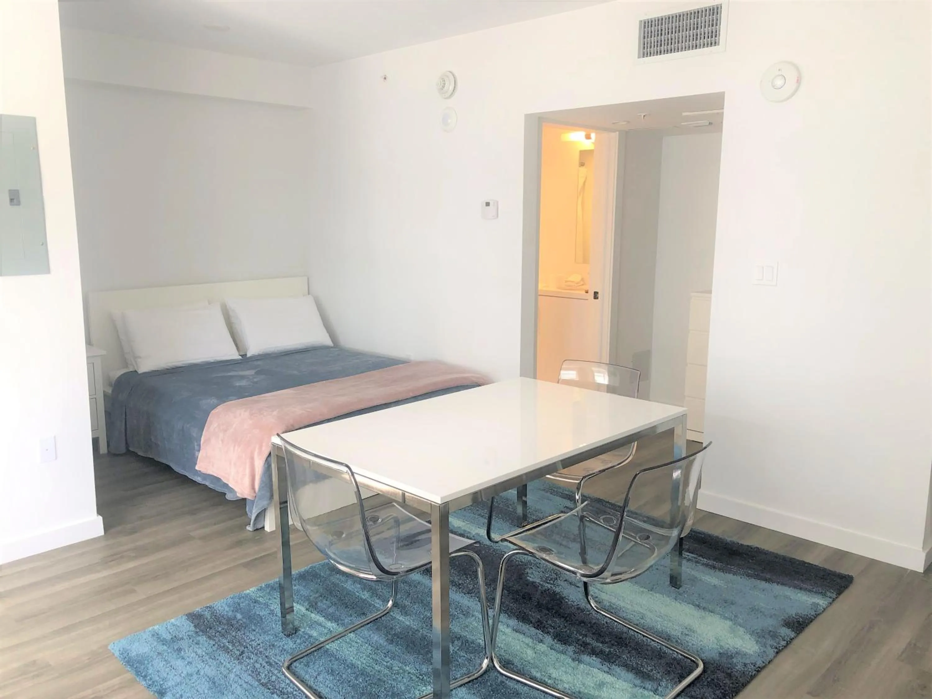 Dining Area in 12th & Ocean Suites by LuxUrban