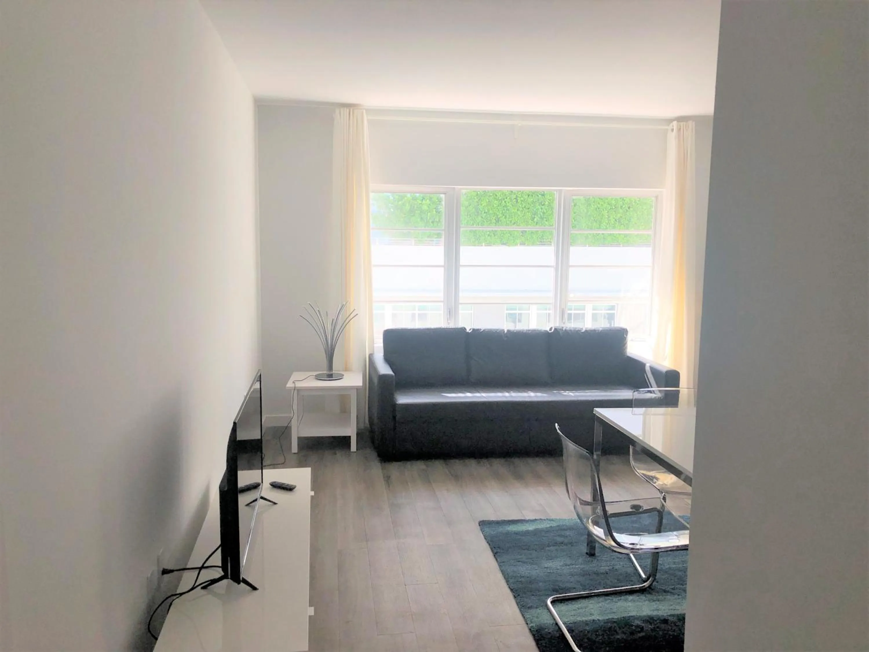 Seating Area in 12th & Ocean Suites by LuxUrban