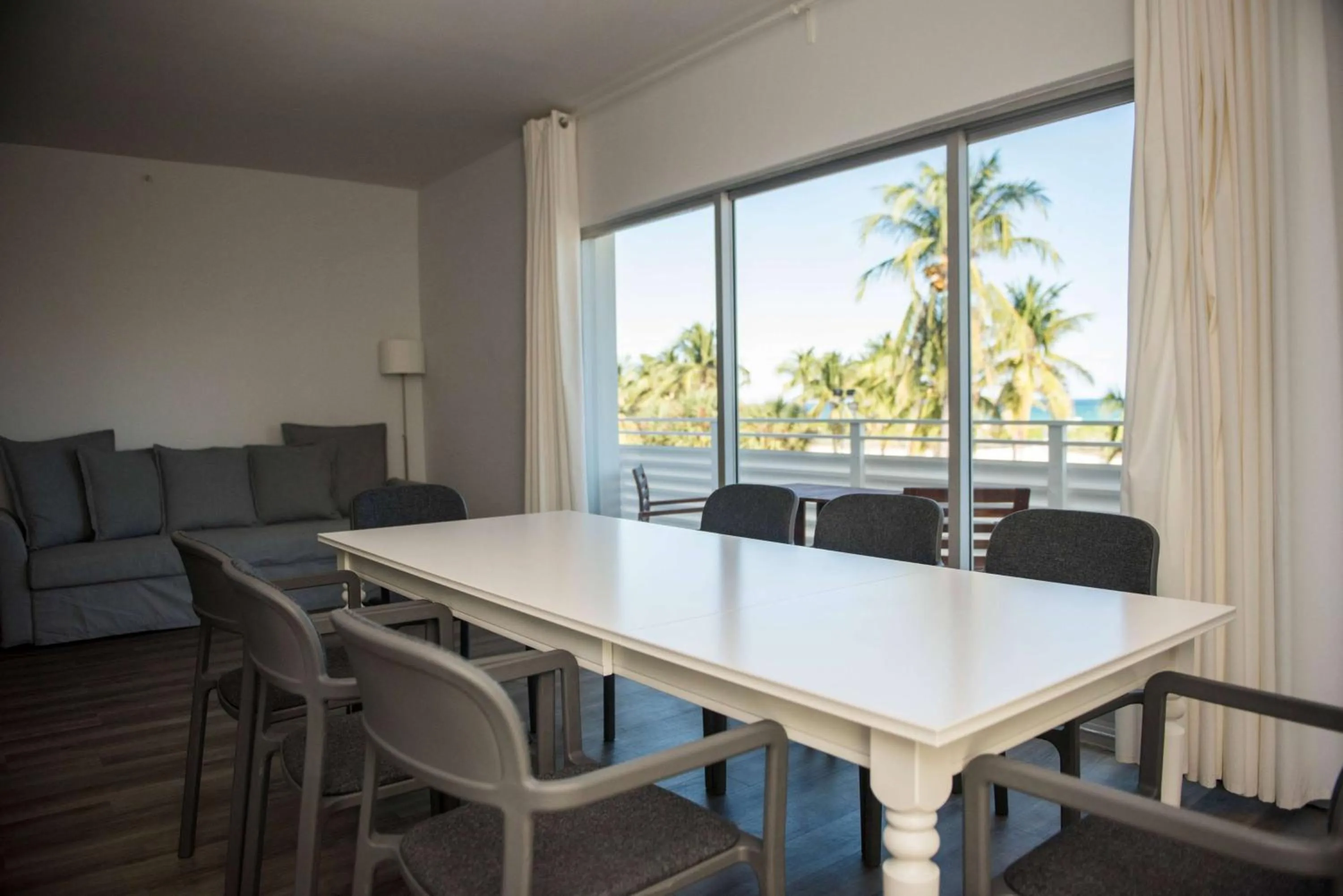 Photo of the whole room, Dining Area in 12th & Ocean Suites by LuxUrban