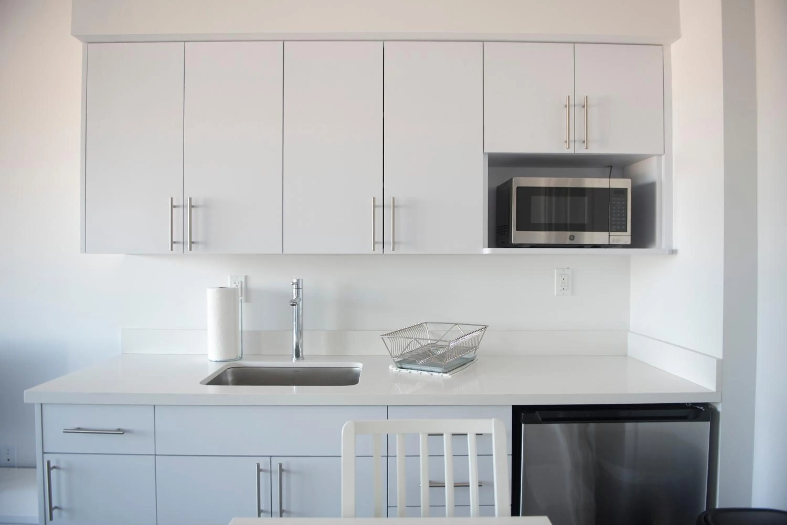 Kitchen/Kitchenette in 12th & Ocean Suites by LuxUrban