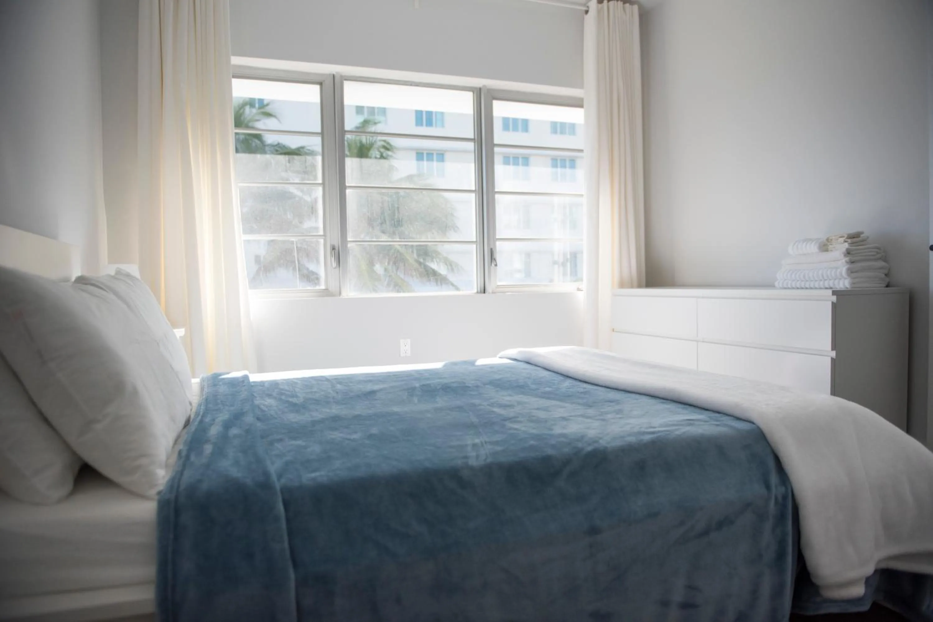 Bed in 12th & Ocean Suites by LuxUrban