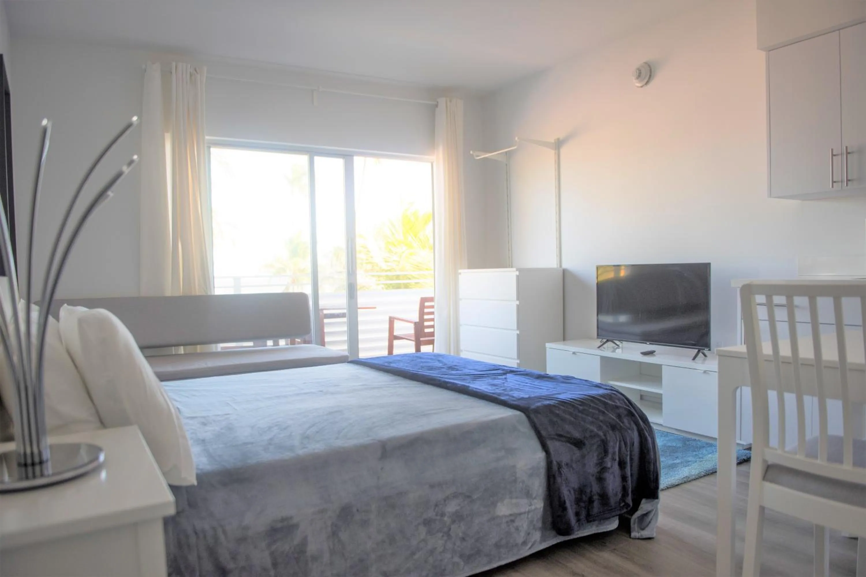 Bed in 12th & Ocean Suites by LuxUrban