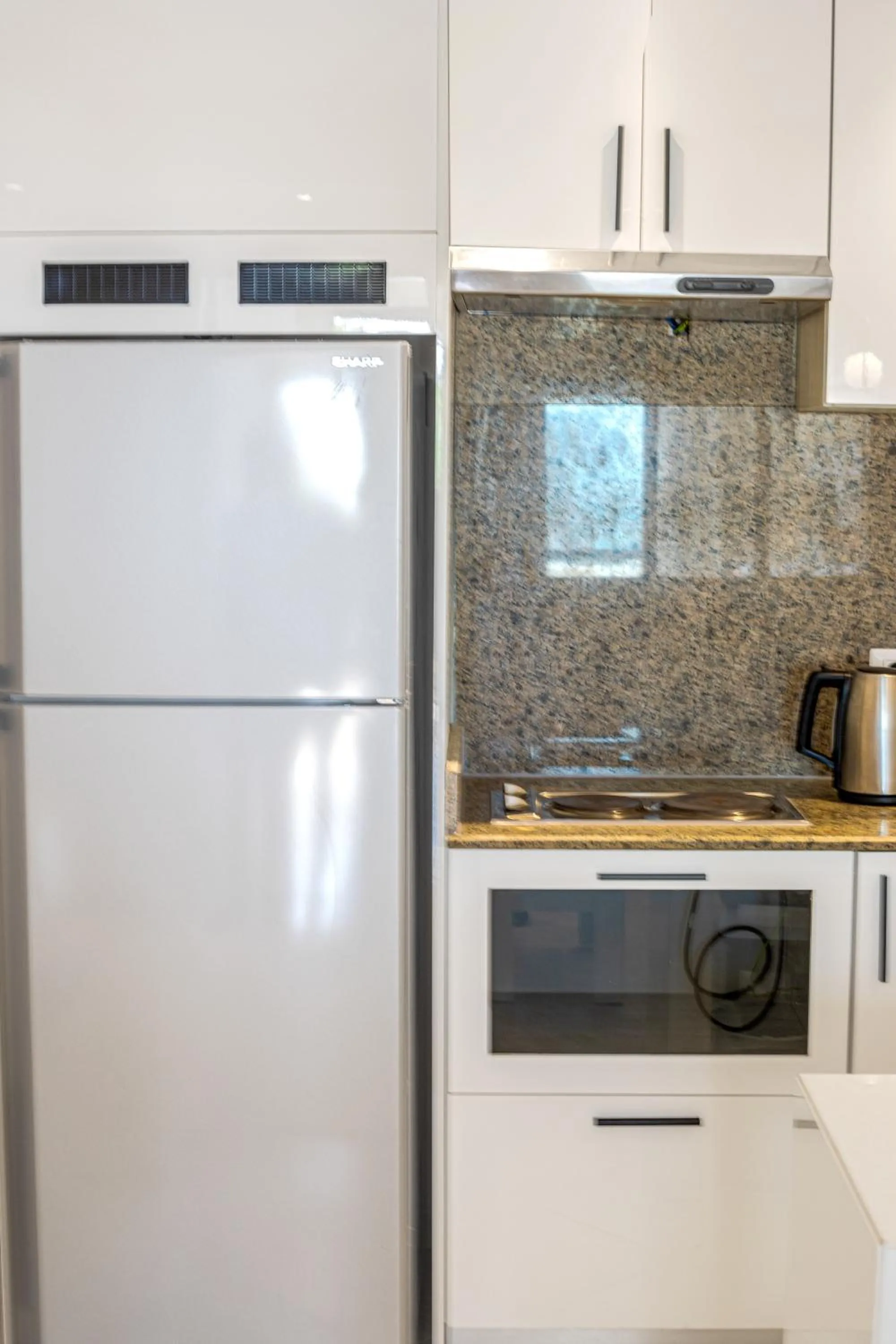 Kitchen or kitchenette in Sky View Suites Hotel