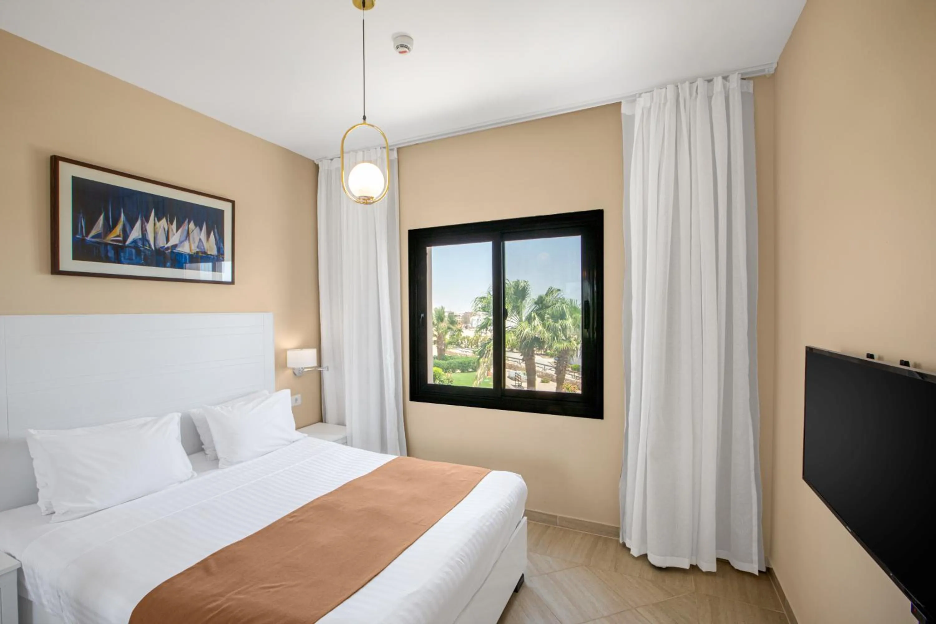 Bed in Sky View Suites Hotel